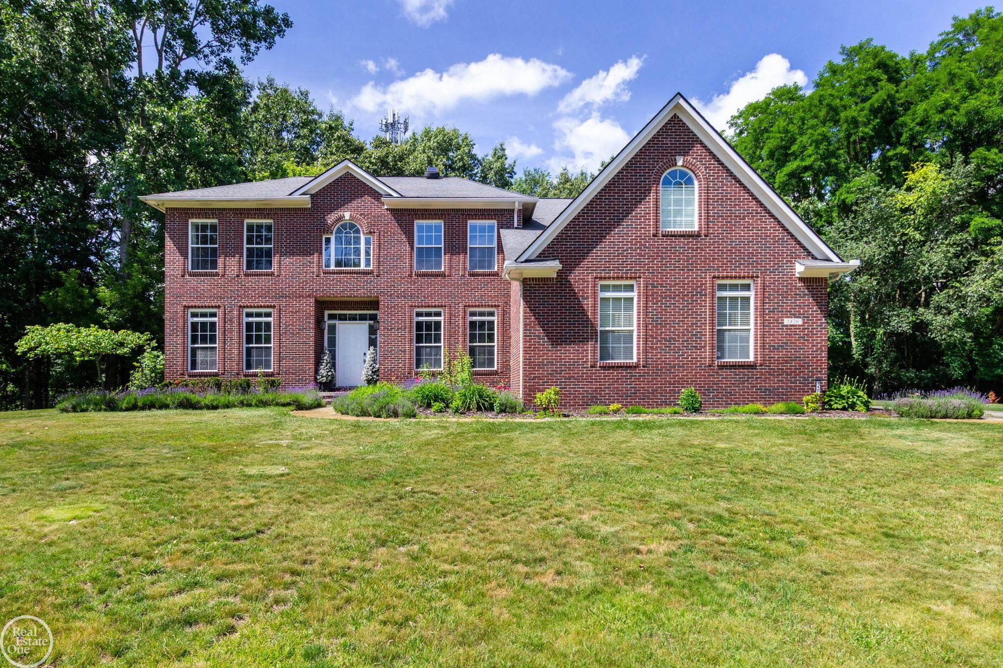 This fabulous 5 bedroom, 4 bathroom family home is totally updated and located on a cul-de-sac in a secluded wooded sub with only 8 homes. Lot size is nearly an acre and your own boat dock is just a short stroll down a wooded path to the Clinton River with direct, convenient access to all sports Cass Lake! Fantastic backyard features expansive deck & patio, walk-out basement, custom firepit & wooded setting. Spacious 3 car garage pre-wired for level 2 EV charger. Transfer switch & generator plug-in have also recently been installed to furnish whole house emergency back-up power. Totally remodeled kitchen with custom cabinets, spacious island, quartz countertops, walk-in pantry, induction stove top & built-in oven & microwave. Newer ceramic & hardwood flooring throughout the entire home. Other recent updates include remodeled primary bath & first floor bath, butlers bar with 2 wine coolers, remodeled great room with new gas fireplace & surround sound. Recessed lighting throughout. Duel staircases & bridge overlooking the great room. Huge primary suite with 22' x 11' walk-in closet, spacious bath & cathedral ceiling. 2nd Floor bedrooms all with WIC's.  Smart home technology includes iPhone access control of lighting, heating, cooling, and even programmable electric blinds. This home has practically every update & improvement making it truly move-in condition!