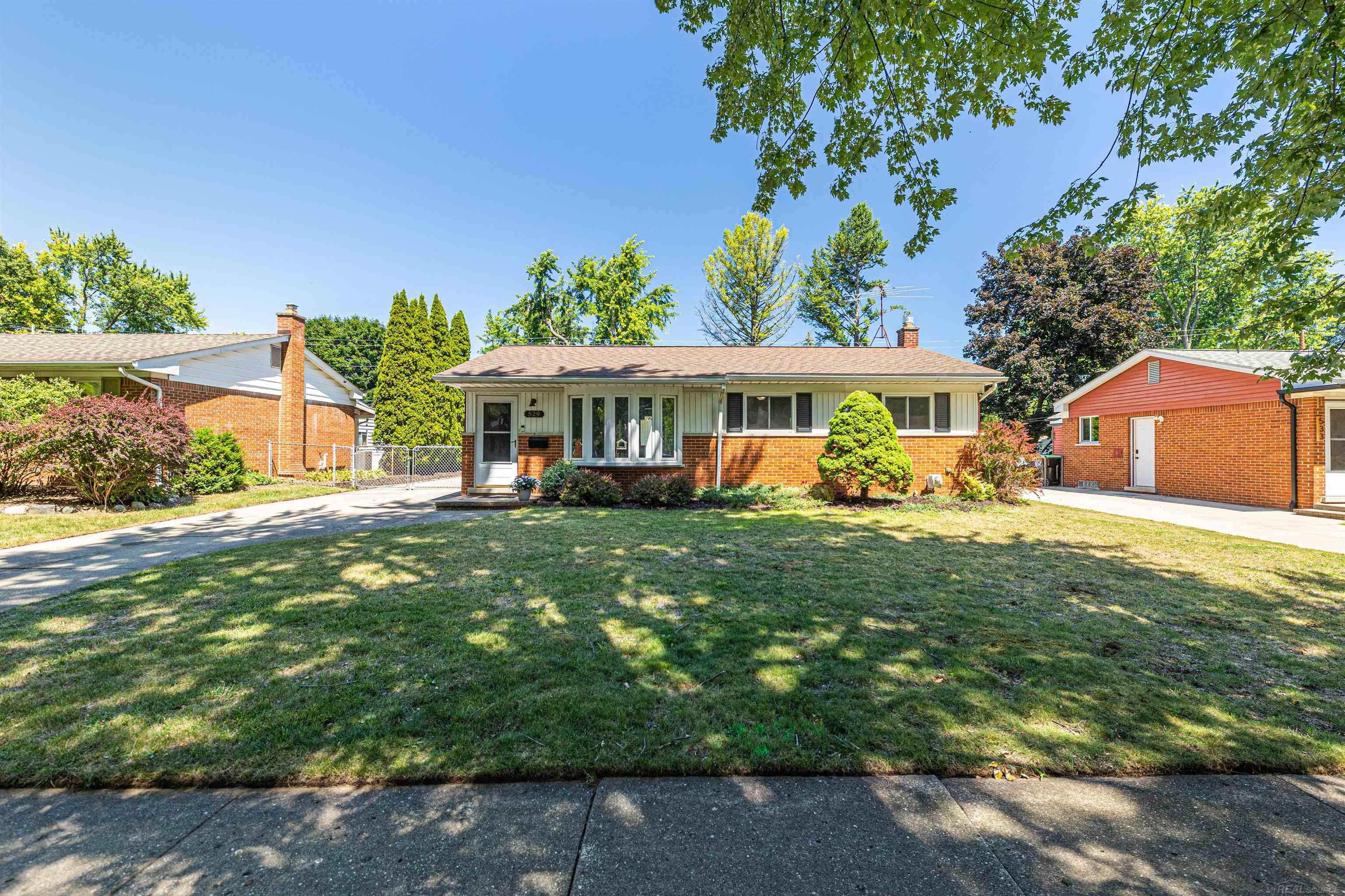 Move right in to an immaculate updated full brick Rochester Ranch.  This home is located right around the corner from downtown Rochester.  Walk to great restaurants, shopping, and more.  The quiet tree lined street will make you feel right at home.  From the entry you can feel all the warmth & light that comes in from the bay window.  A wonderful s[ace to grow your plants.  This home has 3 bedrooms and 2 full bathrooms.  A kitchen with stainless steel appliances and granite countertops.  It has a fully finished basement, a fenced back yard for children and pets with a double gate.  The oversized garage has an attached workshop (20 x 10) for everything from potting plants, to working on home projects, to tinkering with cars.  Furnace was refurbished in 2021.  All appliances stay.  Don't let this one pass you by.