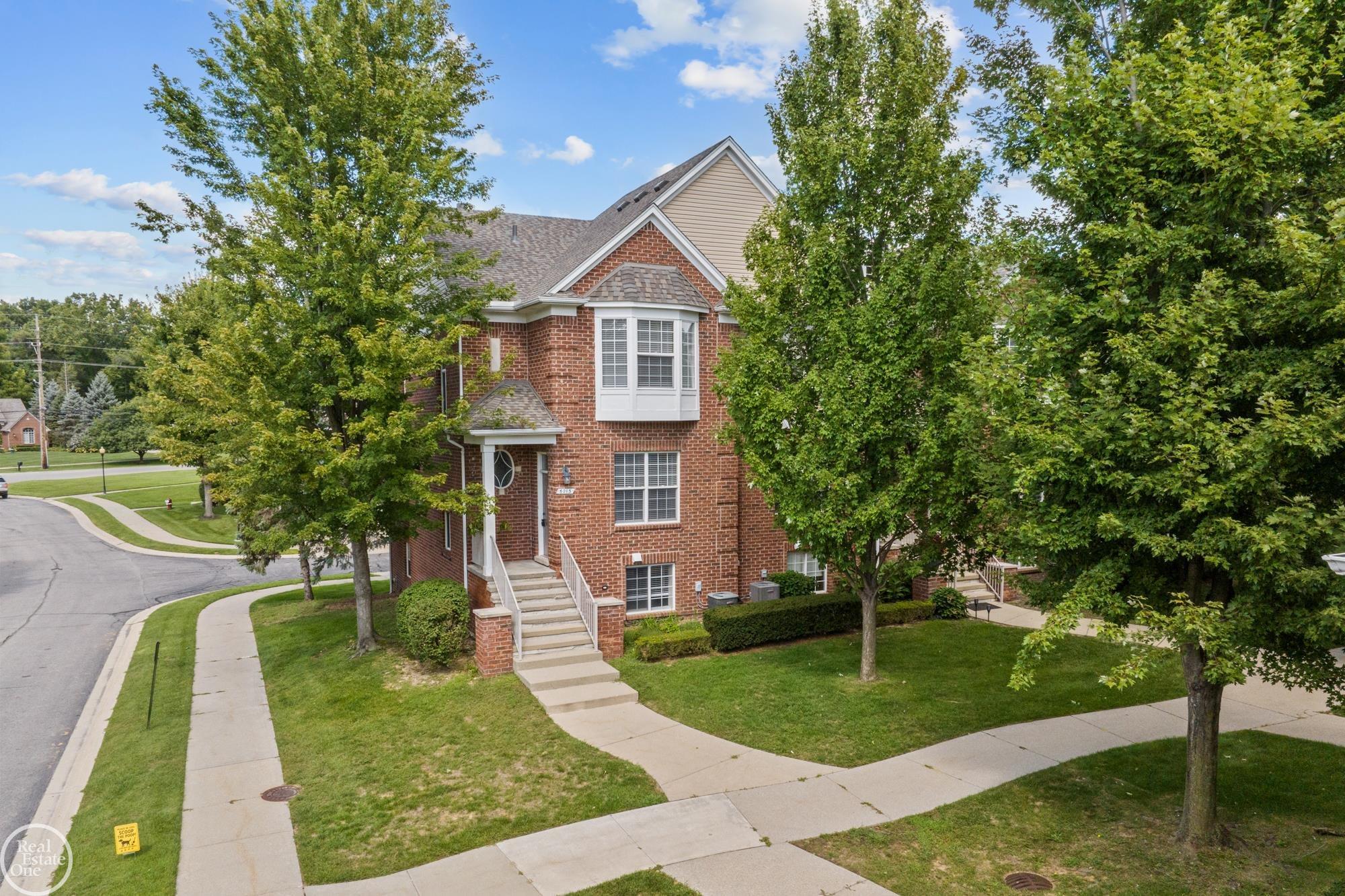 Great Northern Shelby Township Brownstone Condo! This 2 bedroom 2 full 2 half bath condo is located in the well sought after Windemere complex. It has everything you have been waiting for! The Main floor has an open floor plan with high ceilings and includes a Great room with fireplace, a kitchen with new stainless steel appliances, ample storage and a dining area that overlooks the balcony.  The 2nd floor has a Primary Bedroom with an ensuite bathroom and walk-in closet. The second bedroom has a cathedral ceiling, Bay window, walk-in closet and full bath as well. The 2nd floor laundry makes it very convenient for you. Pull into the garage and step into the lower level which can be used as a 3rd Bedroom, Home Office or an entertainment area.... Come see this unique layout as we know you will love it!