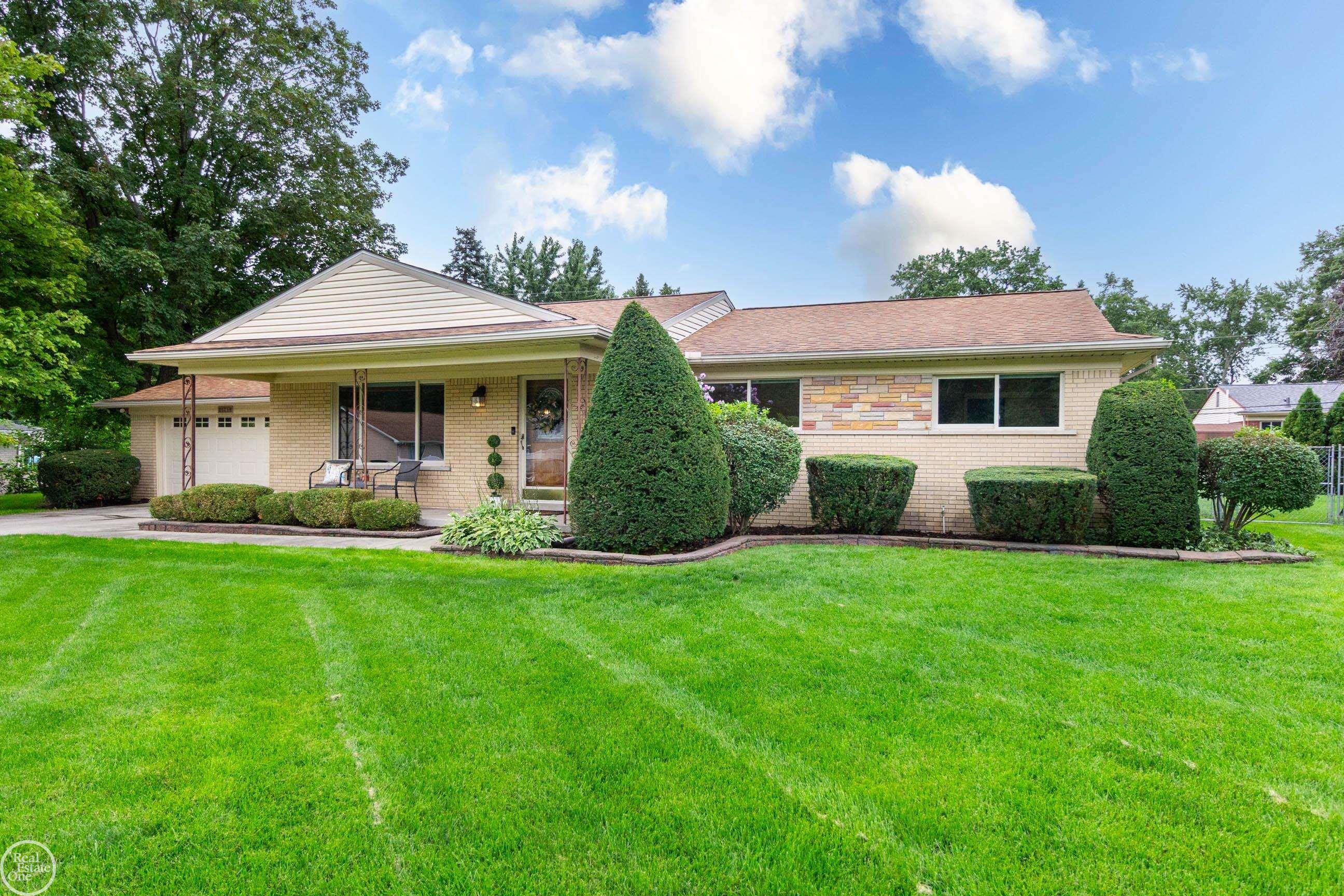 Discover the space, comfort & convenience of this inviting 1,857 sq. ft. ranch offering 4 bedrooms, 2 full baths & an additional 1,857 sq. ft. partially finished basement with abundant storage & flexible space for recreation, hobbies, a home office or future living areas. Set on a .29-acre lot on a quiet dead-end street, this home offers generous room sizes & a comfortable, functional layout. Major updates around 2018 include the roof, furnace & central air, along with interior improvements. Freshly painted T/O with updated windows, brick & vinyl exterior & attached 2.5-car garage. The living/or dining room features a large picture window, gas fireplace & hardwood flooring beneath the carpet. The updated kitchen offers Corian counters, tile backsplash, under-cabinet lighting, abundant cabinetry & drawers, ceramic flooring & included appliances. It opens to an oversized family room with a doorwall leading to the backyard & patio. The updated main bath features dual sinks, walk-in shower with window & ceramic flooring. A second full bath & convenient main-floor laundry add functionality. Enjoy a spacious yard plus Mae Stecker Park just 1.3 miles away. City water, private septic & well-supplied sprinkler system. Approx. 3.5 miles to Hall Rd. with convenient access to shopping, dining, entertainment & freeways.