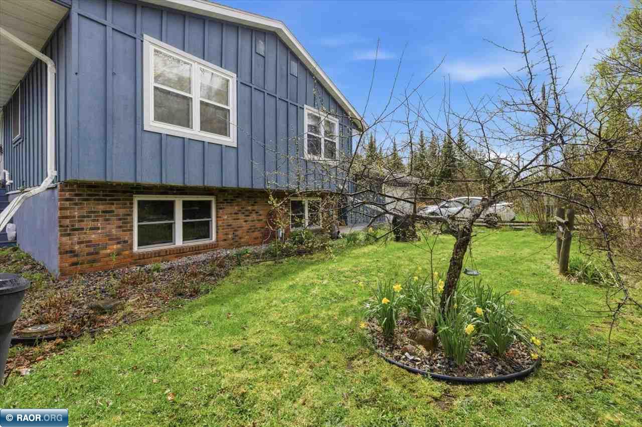 Enjoy peaceful lake living on Little Sand Lake in this well-maintained 3+ bedroom, 2-bath home with over 350’ of shoreline and 1.7 private acres. Large lakeside windows showcase beautiful sunrise views, while the cozy lower-level rec room features a wood-burning fireplace. The current office could easily serve as a 4th bedroom. Home includes updated flooring and baths, newer Kinetico water system, new well pump and pressure tank, generator system, and compliant septic. Walk-out basement leads to a gentle slope to the lake where you can kayak, relax by the firepit, or fish for crappies right off your private dock. Detached garage with off-peak heat plus additional storage sheds complete this up-north retreat. Compliant Septic