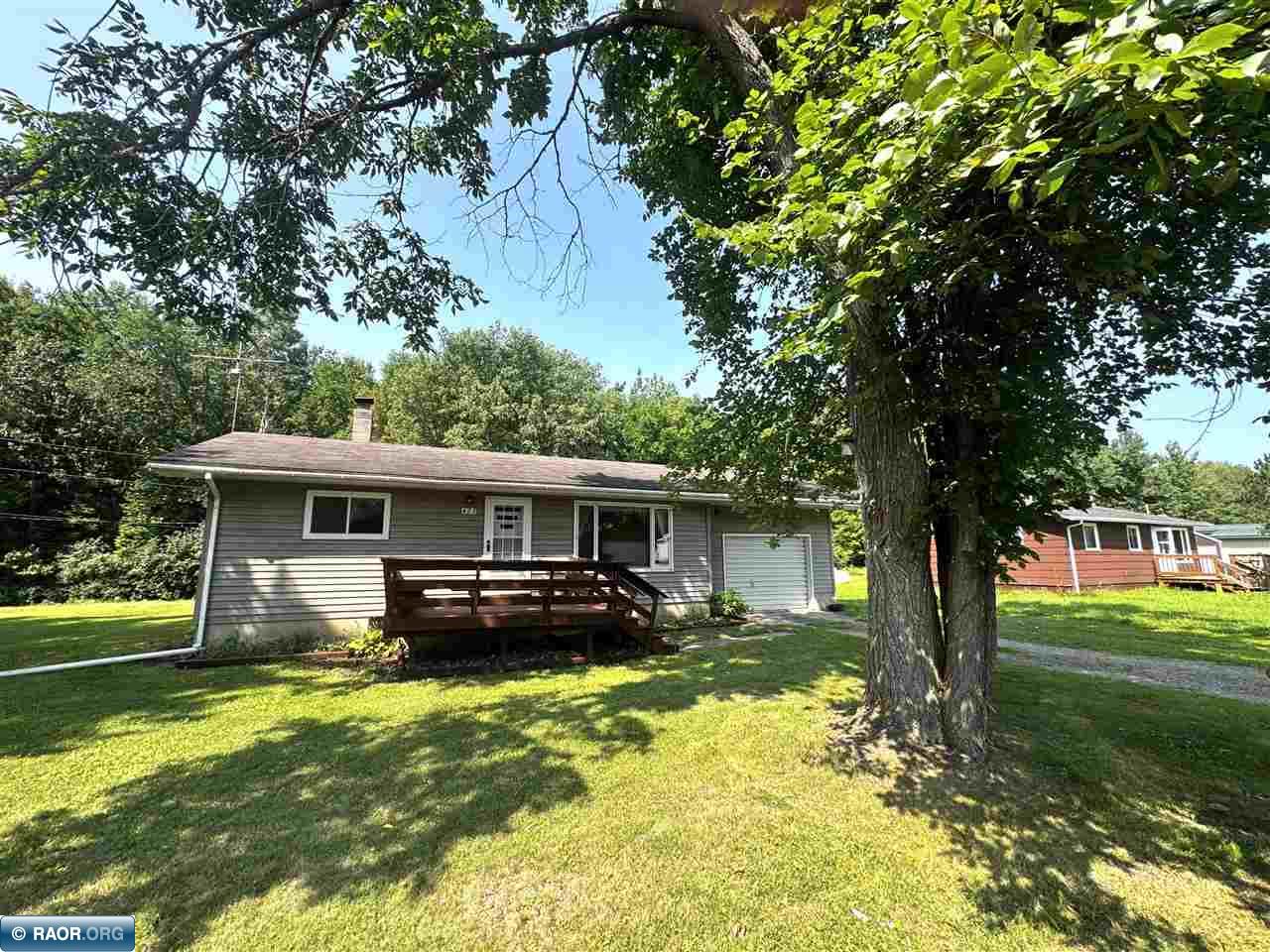 Welcome to 423 1st St SW! This 2-bedroom, 2-bath rambler sits across 3 city lots beneath mature trees, with a roomy backyard that borders a wooded area. Grab your coffee and settle onto the front deck, or head inside where a large picture window fills the living room with natural light and offers a bright eat in kitchen. Downstairs you'll find an additional kitchen area and flexible living space including a non egress potential bedroom creating plenty of possibilities for entertaining, hobbies, guests, or everyday living. Add an attached 1 stall garage and a separate shed with a concrete floor, and there's a lot to love here!