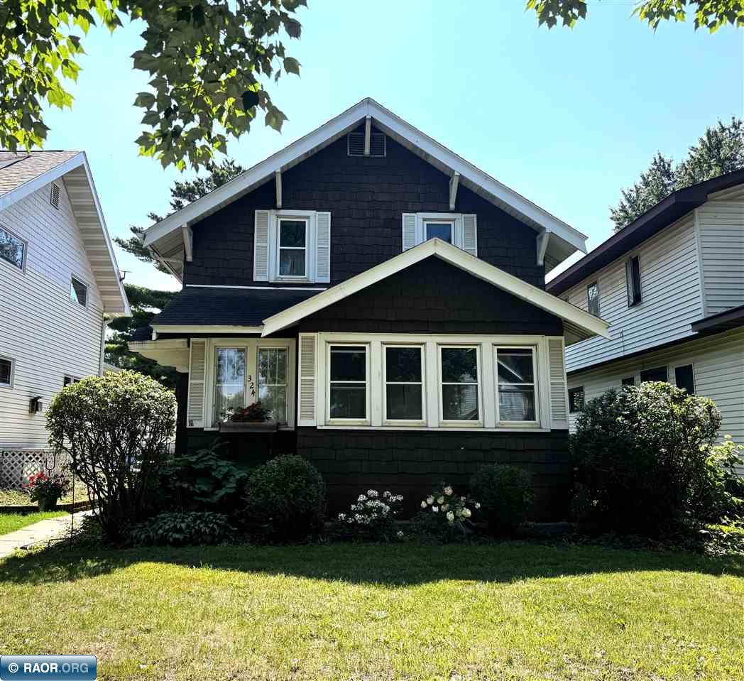 Welcome to 324 11th St S, a character-filled 3 bedroom, 1.25 bath two story home. Warm hardwood floors and Craftsman era details set the tone, while a spacious living room opens to the dining room and sunroom, creating an impressive sight line through the main level. A wall of windows fills the living spaces with natural light, and the sunroom overlooks the backyard and patio. The eat in kitchen offers abundant cabinetry and room for casual dining. All three bedrooms are upstairs, while a sauna adds an unexpected bonus in the basement. Outside, enjoy an inviting backyard plus an additional lot across the alley, offering possibilities, including potential garage space. Conveniently located near parks, schools, restaurants and everyday amenities. Schedule your private showing today!