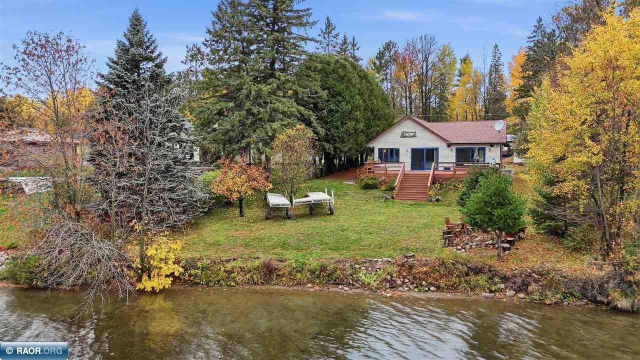 YEAR-ROUND LAKEFRONT LIVING ON DESIRABLE ELY LAKE! Located on highly desirable Ely Lake in Fayal Township, this home offers lake living in every season! Features include newer gas forced-air heating, central air, 200-amp electrical, stainless-steel appliances, huge primary bedroom with walk-in closet, private bath and main-floor laundry. Enjoy your level lot, sandy beach, aluminum dock, lakeside deck, and fire pit! Additional features include newer roofing, siding, and windows, a covered carport, two-stall garage, two sheds, and an asphalt driveway. So much more to offer! Don’t miss this opportunity to enjoy beautiful Ely Lake year-round!