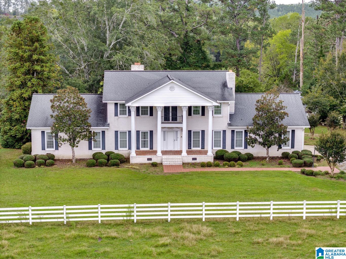 Experience true Alabama country living with this stunning 110 acre farm and estate in Ohatchee AL offering privacy space and endless potential. This exceptional acreage property in Calhoun County Alabama features fenced pasture hay fields multiple barns and a stocked pond perfect for horses cattle farming or recreation. The spacious home includes 6 bedrooms and 5 bathrooms with over 4100 square feet ideal for multi generational living or entertaining. Enjoy wide open views peaceful surroundings and room to create your dream horse property homestead family compound hunting retreat or private estate. Convenient to Birmingham and surrounding areas this Ohatchee land for sale combines rural lifestyle with accessibility. Rare opportunity to own large acreage in Alabama with usable land and infrastructure already in place. If you are searching for farm land for sale in Alabama or a private country retreat this property delivers space freedom and lifestyle.
