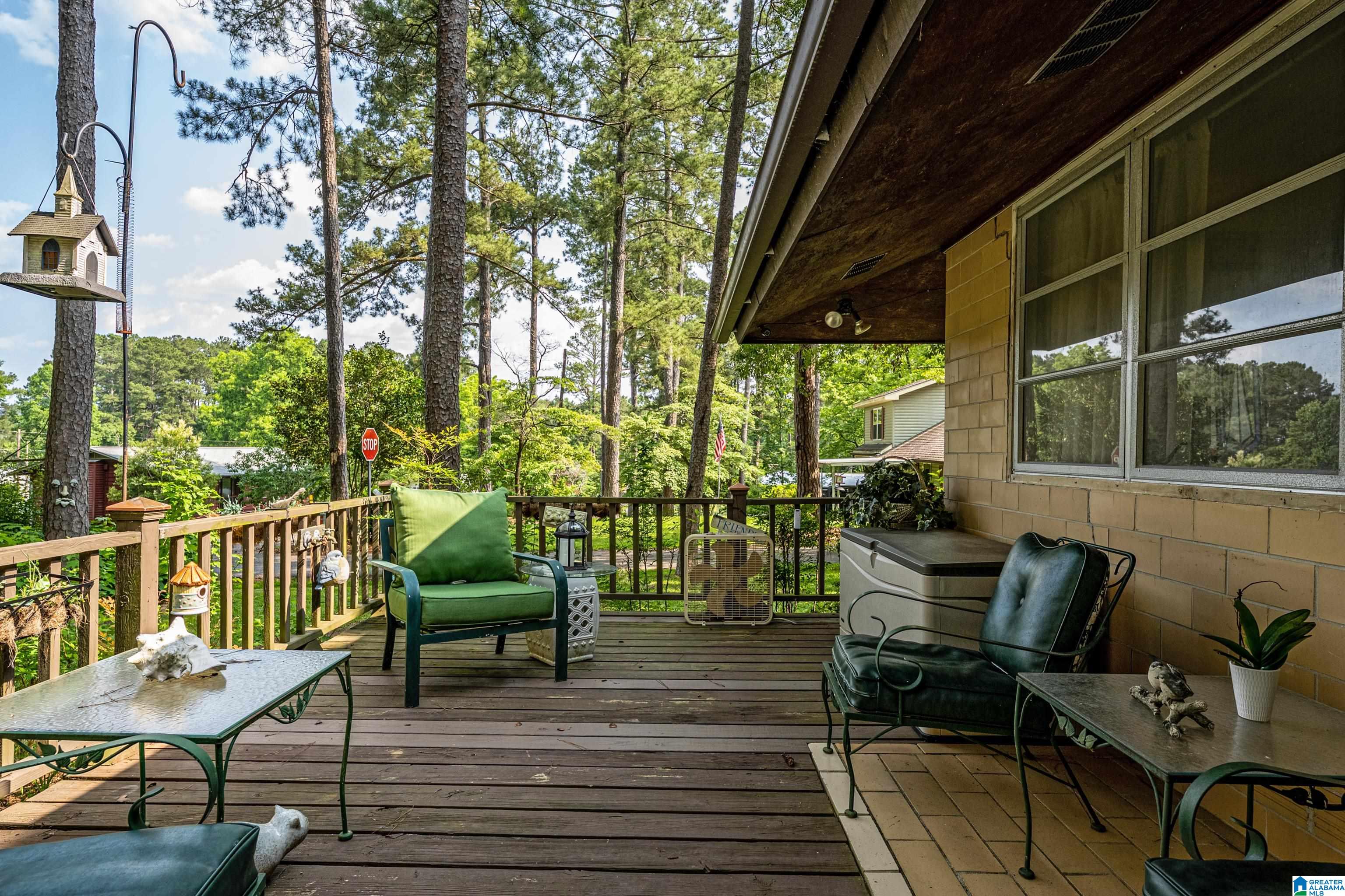 25K PRICE CUT- Adorable Cottage in the Lacoosa area of Lay Lake. This well-loved, off-water endearing one-level Cottage, thoughtfully renovated, is tucked back just enough. Plenty of outdoor space with three lots. Enjoy Seasonal Lake views from the deck, and only blocks from the Lake, minutes to Bozo’s Marina and Lacoosa Marina. Seamless Open Living/Kitchen balances historic character with modern updates. This two-bedroom home includes a beautifully updated bath and transitions effortlessly to an extended deck, offering the perfect space for outdoor living. Efficiency meets versatility in the detached storage building, which features powered carriage-style double doors, a second bathroom, and laundry facilities. Whether you are seeking a lake getaway or primary residence, this one is budget-friendly and is turnkey. Commutes are easy to Historic Columbiana and I-65. Go look today- at this price, it will not last! Home sold As-Is.