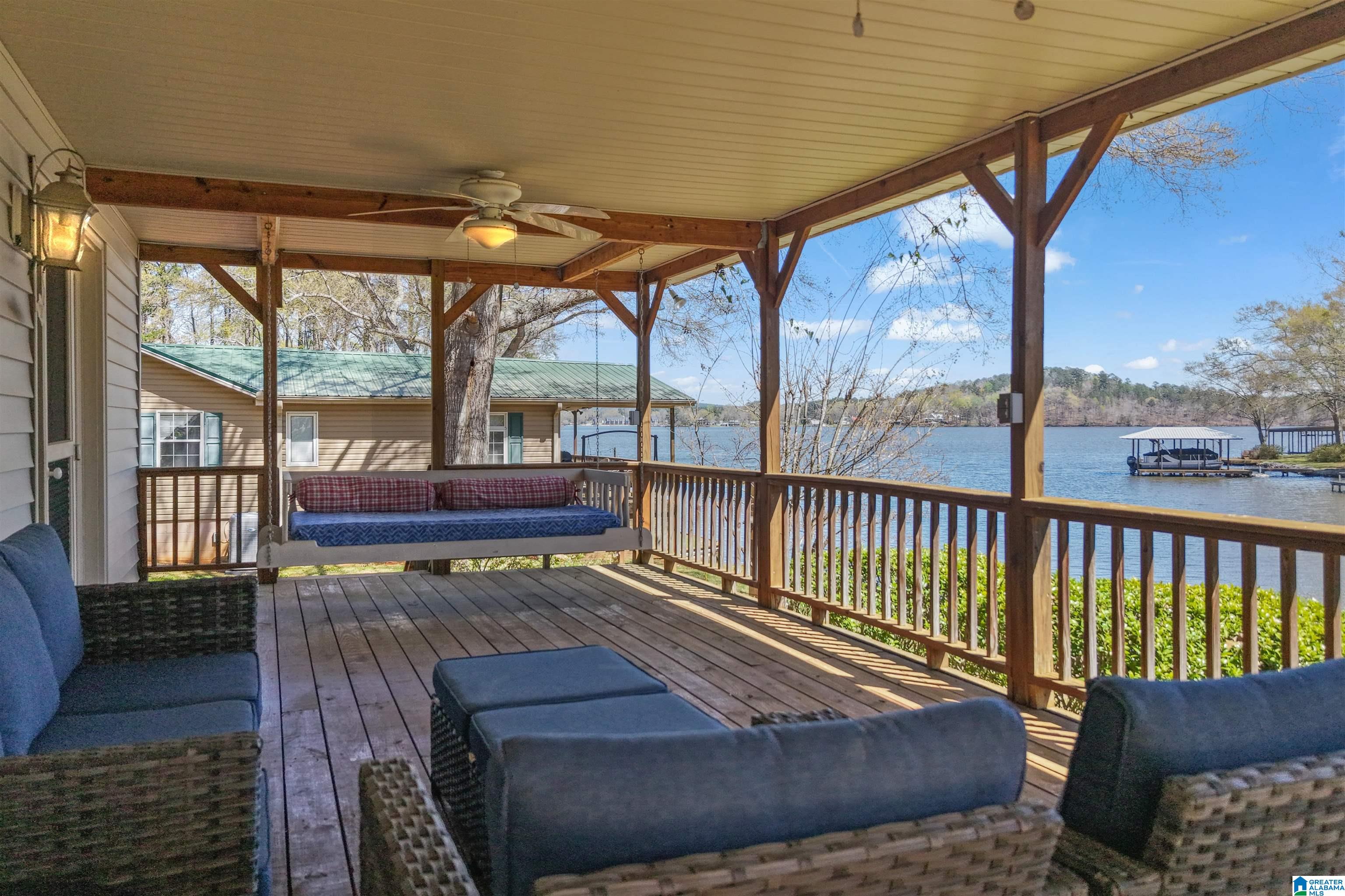 If “quintessential lakehouse” had an address, it would be 100 Horn Dr. Rare opportunity for a Lay Lake retreat in Shelby Shores w/main channel views, great outdoor spaces & the BEST neighbors! Situated on 3/4 of an acre, this property offers one of the most sought-after features on the lake: a FLAT lot. From the inviting front porch to the covered back porch complete with a bed swing for napping this home is full of warmth, charm and places to relax. The main level features a spacious family room, cozy, keeping room with wood-burning fireplace that is open to the breakfast bar & kitchen. There is a main level master bedroom, bath and laundry room. Upstairs is a large 2nd master suite w/great lake views & large closet. Bedrooms 3 & 4, full bath and an enormous bonus room currently used as a bunk room. Lots of space for toys in 2-car garage & 2 stall boathouse. Shelby Shores also offers an active community center with events and activities throughout the year.