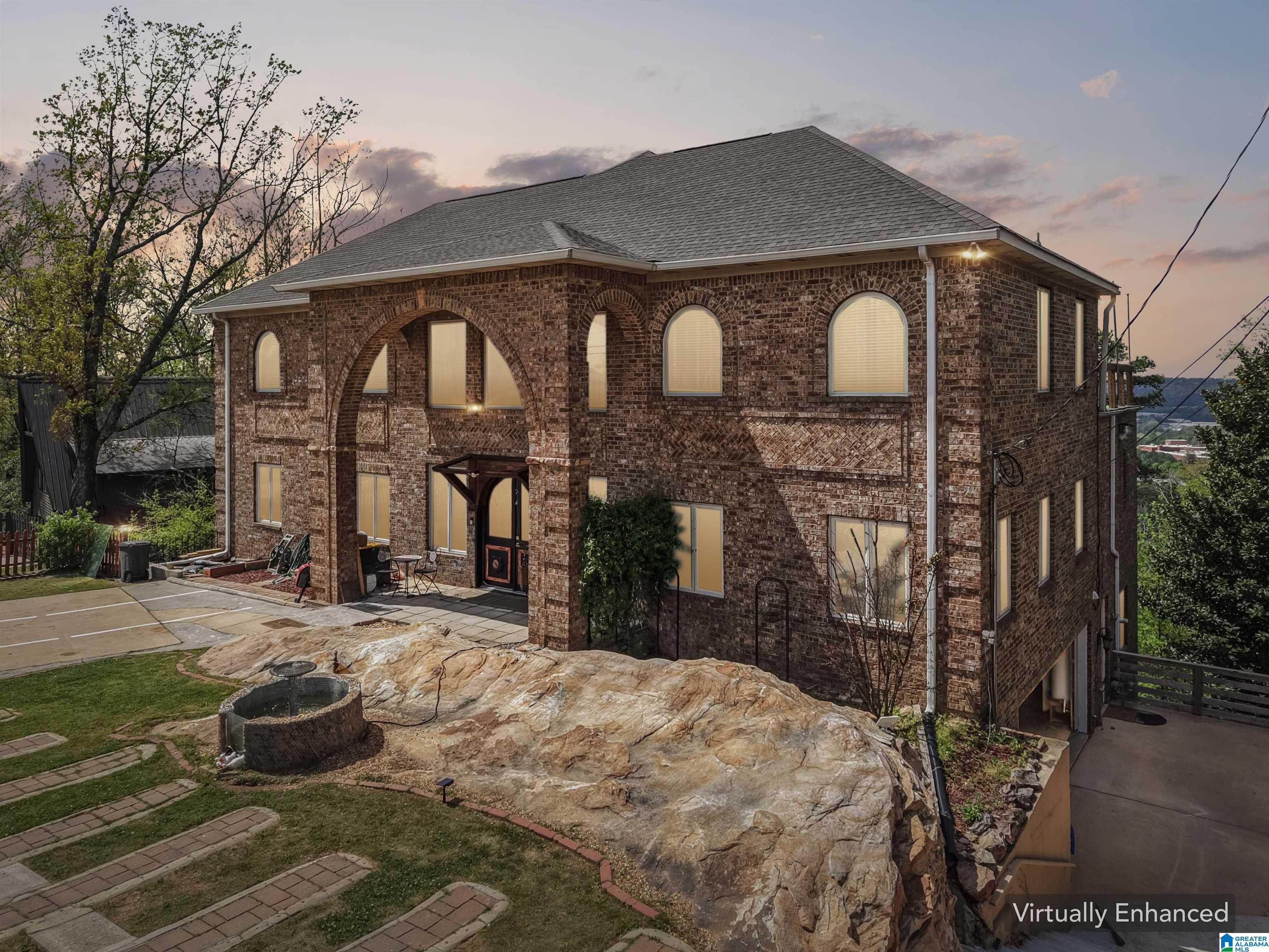 This is the 1000 character spot Realtors get to describe a home. Many of us use cheesy, cliche phrases like, "amazing view," etc. But in my last 10 years in real estate, I've never had a listing like this and find it hard to explain. The photos do not paint the picture. You'll tell your friends about the interior of  this home. It really must be seen in person. All the wood you see in this home is hand-carved. The floor is hand-laid porcelain. The front door was hand-made, as were the 25' tall curtains on either side of the grand entrance. The 2nd level is totally separated with it's own entrance for occupants who want their own space. Literally, like a house inside a house. The lower level has an art studio and HUGE workshop. The two bedrooms on the rooftop level are over 30x20 feet, each with their own bath and private rooftop terrace. AMAZING view!