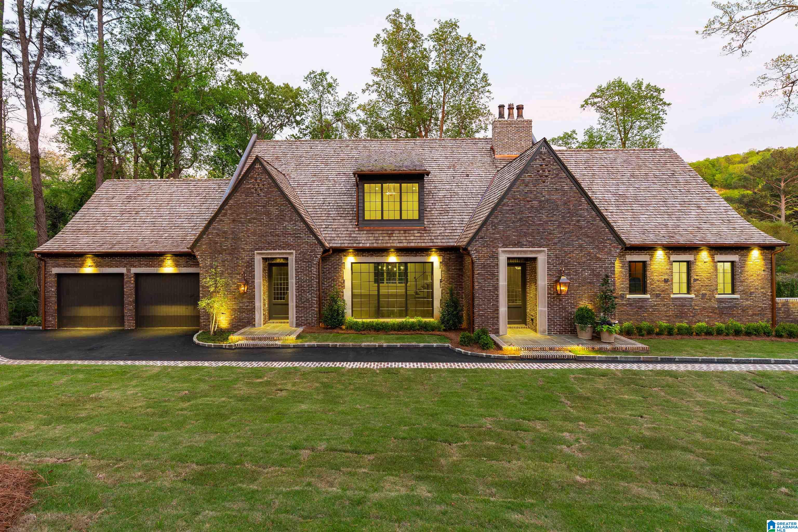 New construction in Mountain Brook with a layout and level of finish not often available. The main level is designed for everyday living with a custom kitchen featuring La Cornue range, SubZero refrigeration, marble surfaces, and detailed cabinetry. Primary suite includes sitting area, dual closets, and a well-appointed bath. Main level two-car garage with over eleven-foot ceilings.  Upstairs offers three bedrooms and three baths, including two bedrooms with adjoining baths, plus a large bonus room with closet and window that can function as a fourth bedroom. The lower level includes two large bedrooms with private baths, kitchenette, along with media, fitness, and work areas, plus an insulated wine cellar.  Outdoor living includes upper terrace along with lower covered space, kitchen, and pool with a professionally created private rear yard. Whole-home generator, up and down lighting, and prewired audio/visual integrated throughout.