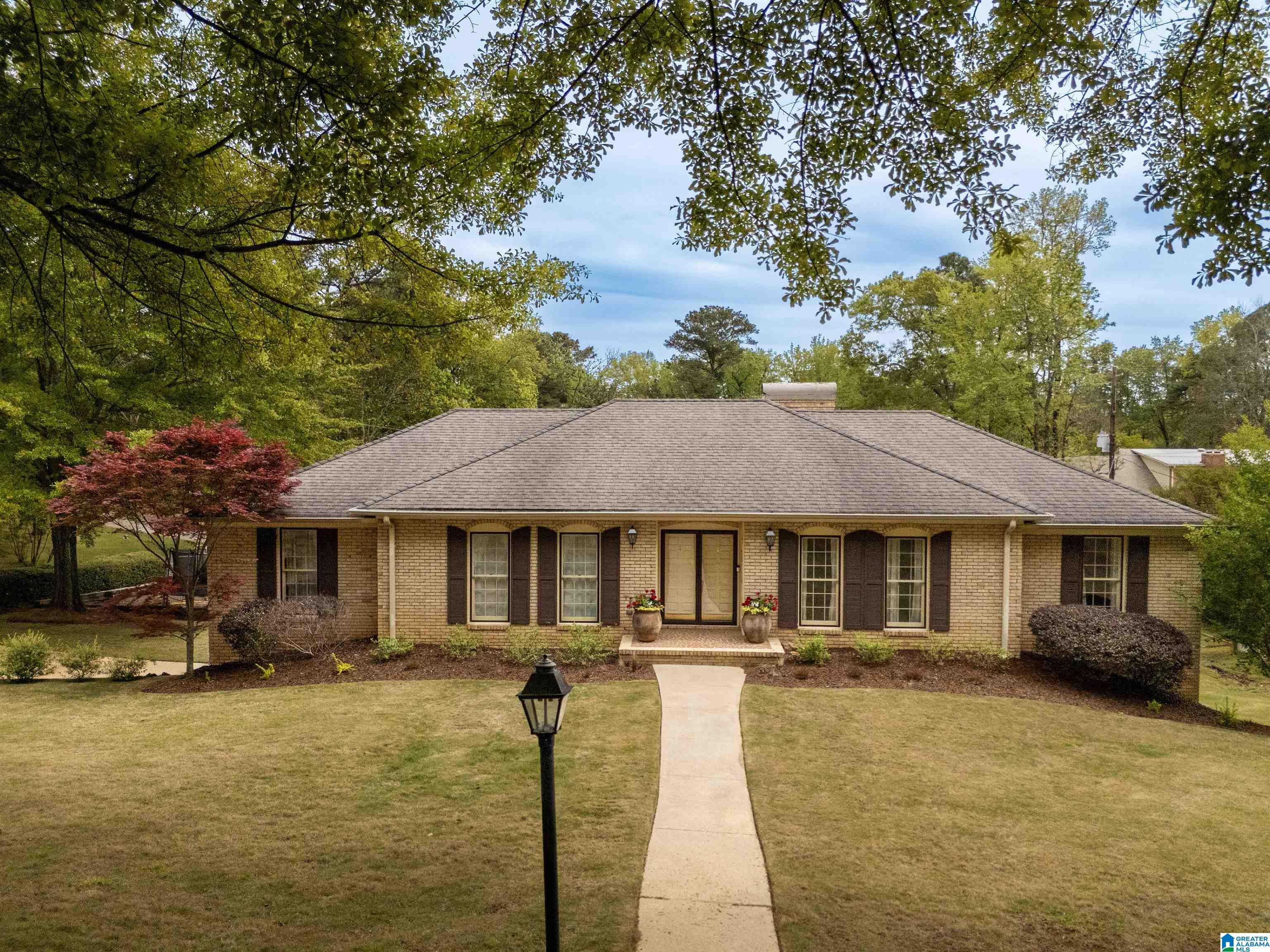 Rare opportunity in the heart of Mountain Brook! Situated on an estate-sized corner lot at 3499 Westbury Road, this 4-bedroom, 3-bath home offers exceptional potential in one of the area’s most sought-after locations. Less than one mile from Mountain Brook High School and zoned for Brookwood Forest Elementary, this 1968 original is a true blank canvas with solid structural bones and timeless layout potential. Featuring basement-level parking with space for three vehicles in the oversized two-car garage, this home is ideal for buyers looking to renovate, expand, or create long-term value. Whether preserved and enjoyed as-is or thoughtfully updated over time, this home is poised to serve its next family for years to come. With an unbeatable lot, location, and endless possibilities, opportunities like this rarely come to market and are not expected to last long.