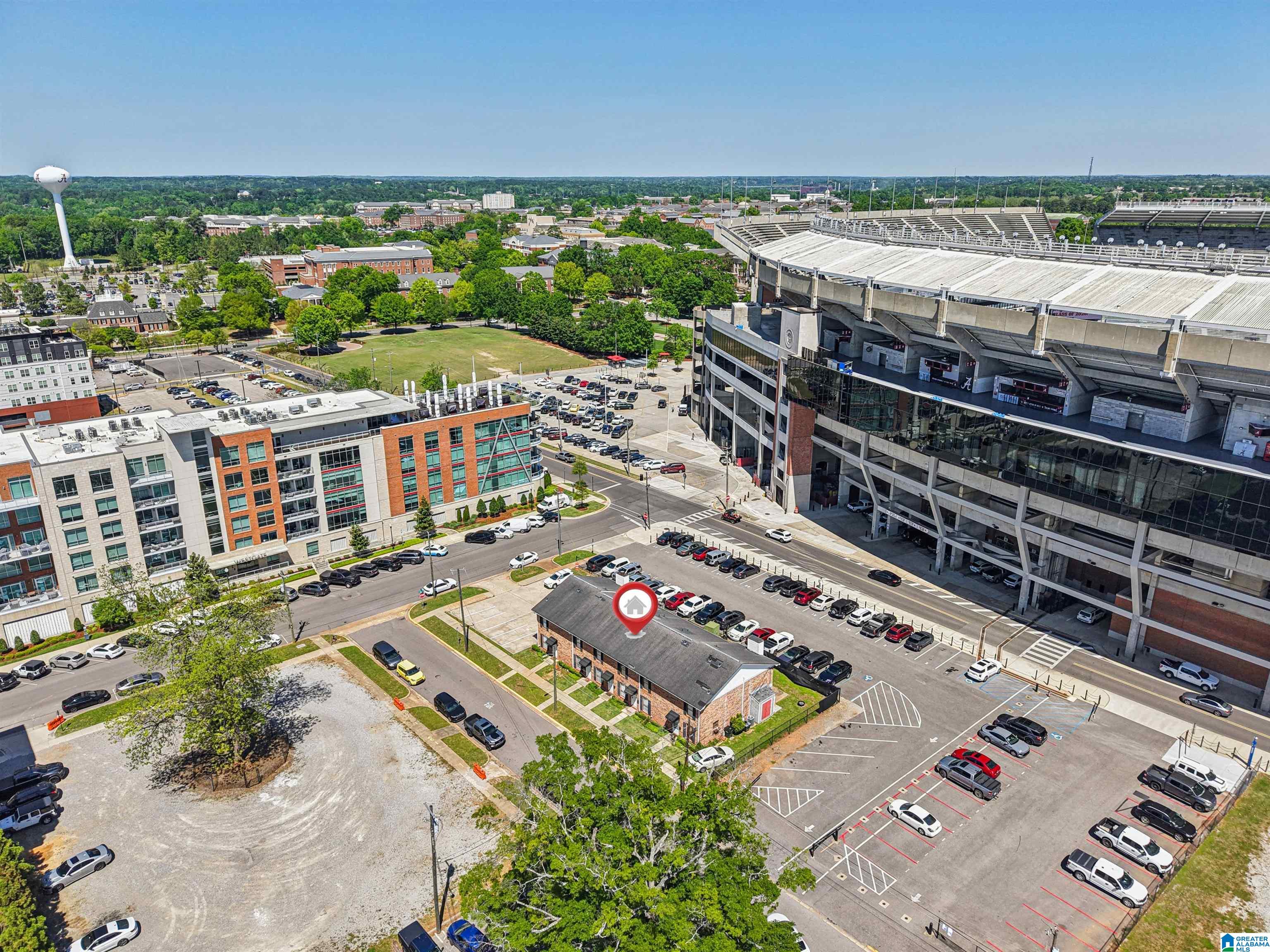 Amazing location just steps from Bryant Denny Stadium! Experience game day and campus life at the University of Alabama from this beautifully remodeled 2 bedroom, 1 bath condo. This upstairs unit offers secured building access plus a private entrance for added convenience and peace of mind. Inside, you’ll find an open layout with updated finishes, LVP flooring, recessed lighting, and a stylish kitchen featuring stone countertops, stainless steel appliances, and custom cabinetry. The spacious living area is ideal for entertaining, while both bedrooms offer great natural light. Enjoy a dedicated laundry space and step outside to your private deck, perfect for grilling and game days. Two assigned parking spaces provide rare off street parking this close to campus. Ideal for owner occupants, students, or investors seeking a prime location in Tuscaloosa.