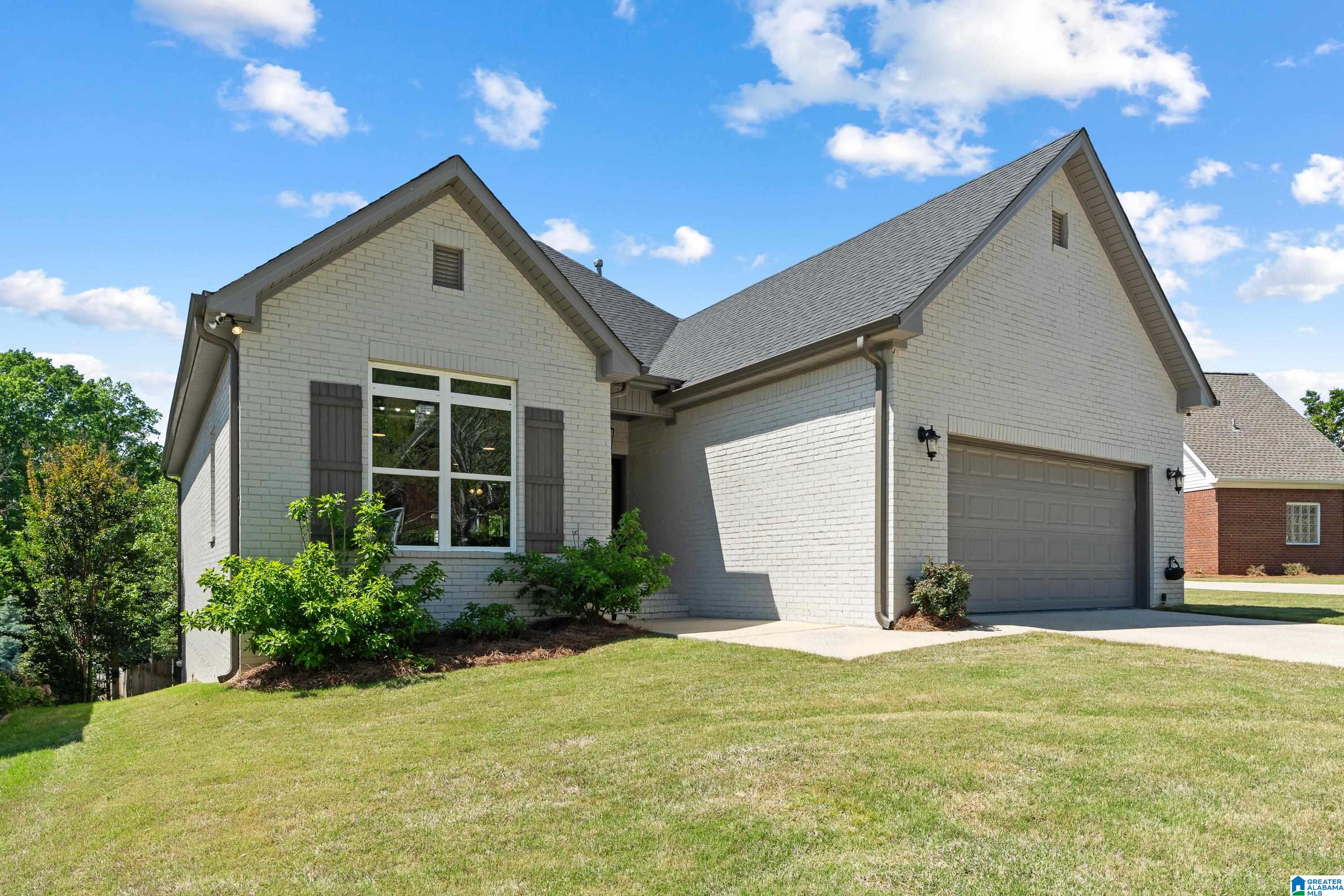 Pristine with water views in Eagle Point! This full brick 5BR/3BA home offers over 3,000 sf and is move-in ready with Smart Home options! French doors welcome you into a light-filled main level with gleaming hardwoods and over 2,000 sf of living space. Formal dining room is perfect for entertaining. Updated kitchen features quartz countertops, island, and tiled backsplash. Spacious living room showcases an accent wall and brick fireplace, with access to a screened deck overlooking the water. Private main level owner’s suite includes a spa bath with soaking tub and oversized shower. Split floorplan offers an additional guest bedroom and full bath on the main level. Finished basement boasts media room, 3 bedrooms, full bath, office, and bonus room for future expansion plus a kitchenette with potential for a second kitchen. Lower patio easily accesses the fenced backyard. Community pool & prime location near Tattersall Park and Lee Branch make this fantastic find an easy YES.