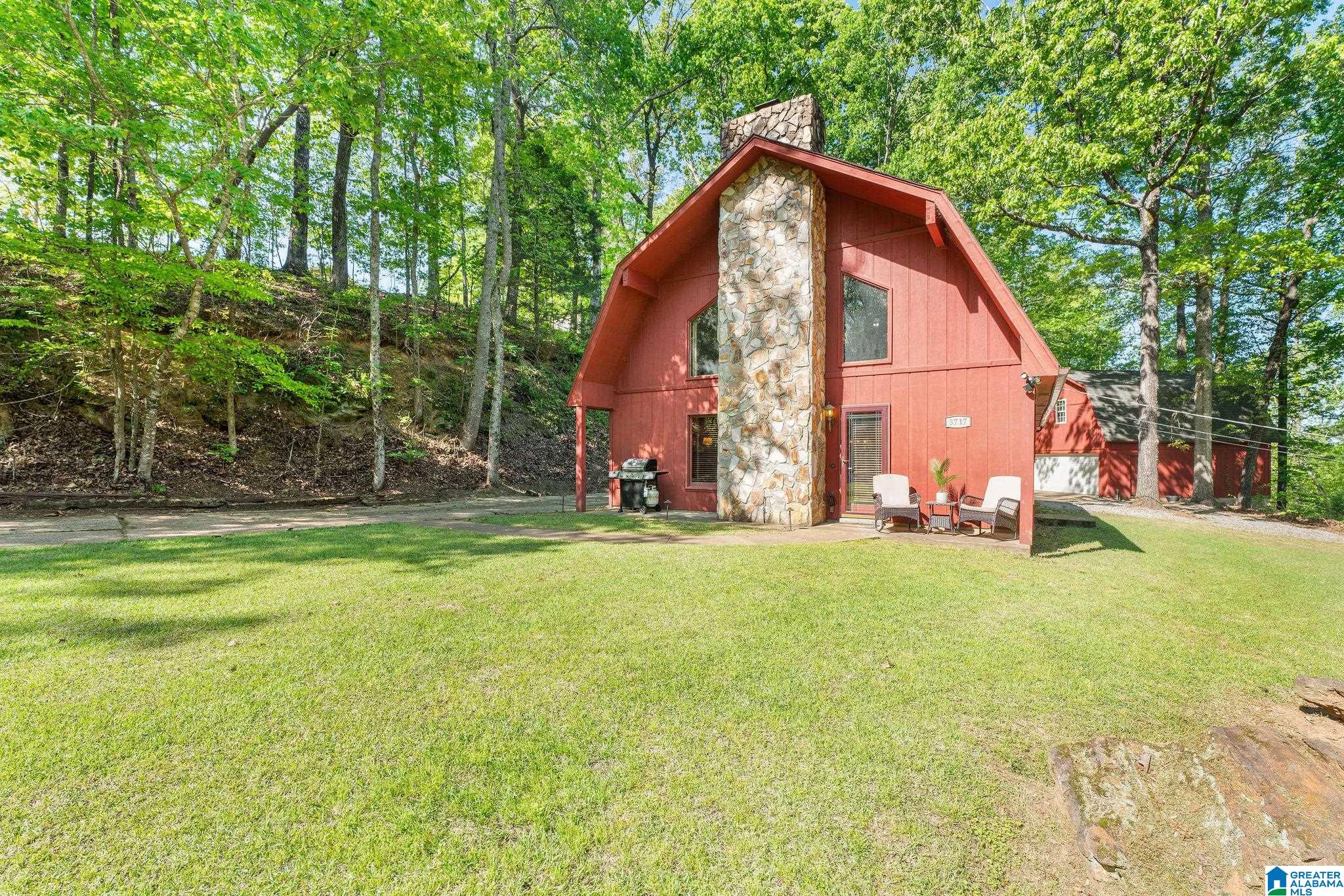 Fully furnished and being sold turn key, this is one of the most peaceful spots in Spring Hill Lake. Welcome to your dream getaway with views of Springhill Lake! This 2-bedroom, 2-bathroom cozy cabin spells RETREAT! With an open-concept, loft, and beautiful ceilings with a rock fire place. The Extra large lot offers space to spread out, basketball goal with detached 2 car garage and unfinished space above the garage that could be another living area. Schedule your showing today! Currently a successful short term rental. Call to schedule your showing today!