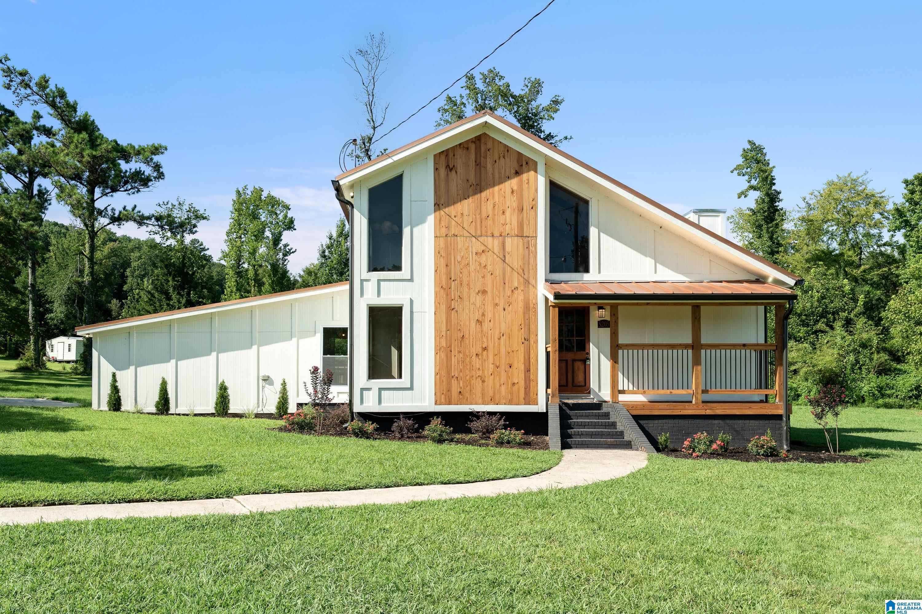 Oooh....baby!  This one is a charmer!  If you are looking for something that is anything but cookie-cutter then this Oak Mountain gem may be for you!  Completely renovated inside and there is nothing to do but back up the moving truck and start living your best life! This home is situated on a large, flat, cul-de-sac lot with no HOA.  The primary bedroom is on the main level and features a renovated primary bathroom.  The main level flows perfectly for having guests over or just having chill time in front of the fireplace.  There is a large eat-in kitchen that opens up to the expansive deck where you can sit and enjoy watching nature and will likely spot a deer or two! There is a newly added laundry room and half bath on the main level as well. Upstairs you will find 2 large bedrooms with a shared bath. This home has great storage from the 2-car garage to the outdoor storage area.  Just minutes from all Oak Mountain schools, parks and more! New Windows.  Metal roof.