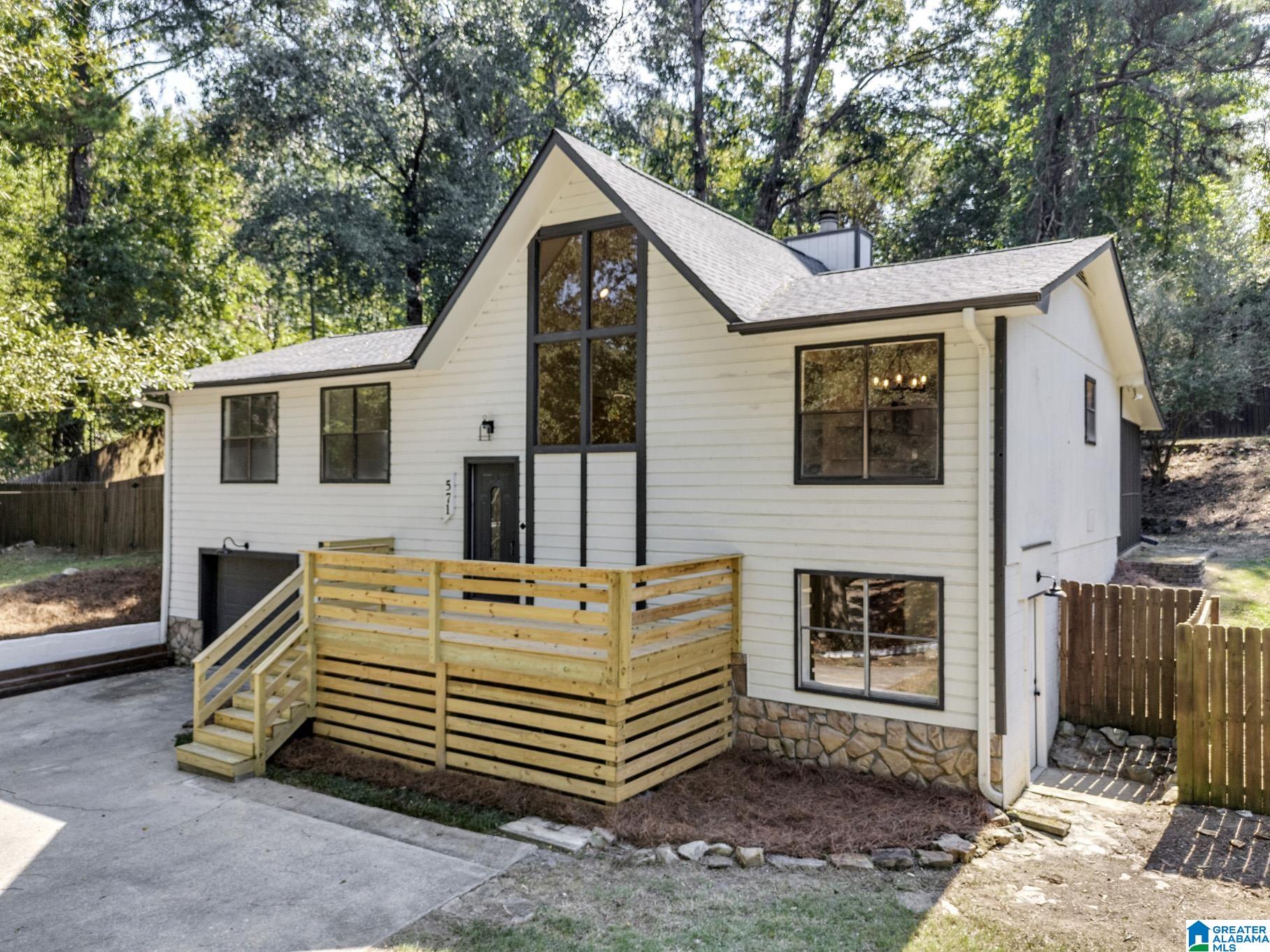 An incredible opportunity to own in Trussville City Schools! This fully renovated 4 bedroom, 2 bath home offers space, style, and peace of mind with modern updates inside and out. Step inside to an open, light-filled living area featuring vaulted ceilings, sleek horizontal iron railings, and a statement floor-to-ceiling painted stone fireplace. The brand-new kitchen is ready for family dinners and entertaining, equipped with crisp brand new white cabinetry, stainless appliances, and an easy flow straight into the dining area. Both full bathrooms have been completely remodeled with stylish fixtures and finishes. With fresh interior and exterior paint, recessed lighting, and four full bedrooms providing flexible room for guests, hobbies, or a home office, you can move right in and start enjoying the Trussville lifestyle. Schedule your showing today! Minutes to entertainment district, shopping and schools! NEW HVAC & Furnace. NEW water heater. NEW kitchen cabinets, countertops and appl.