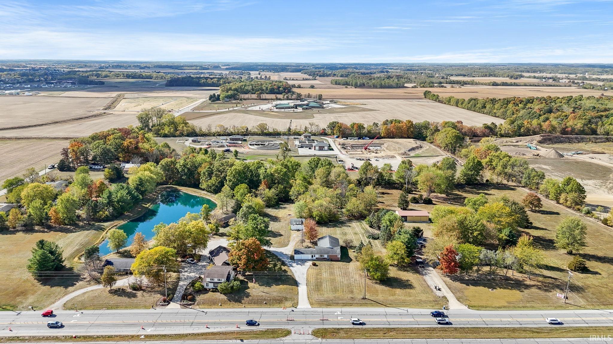 Aerial view of sparsely populated area with a large body of water