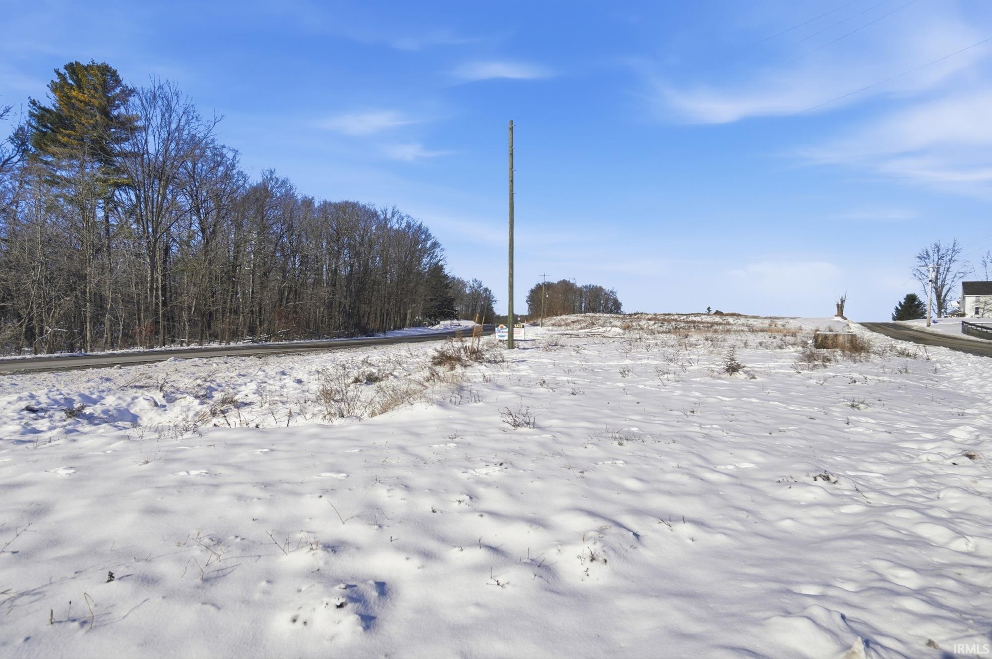 View of yard covered in snow