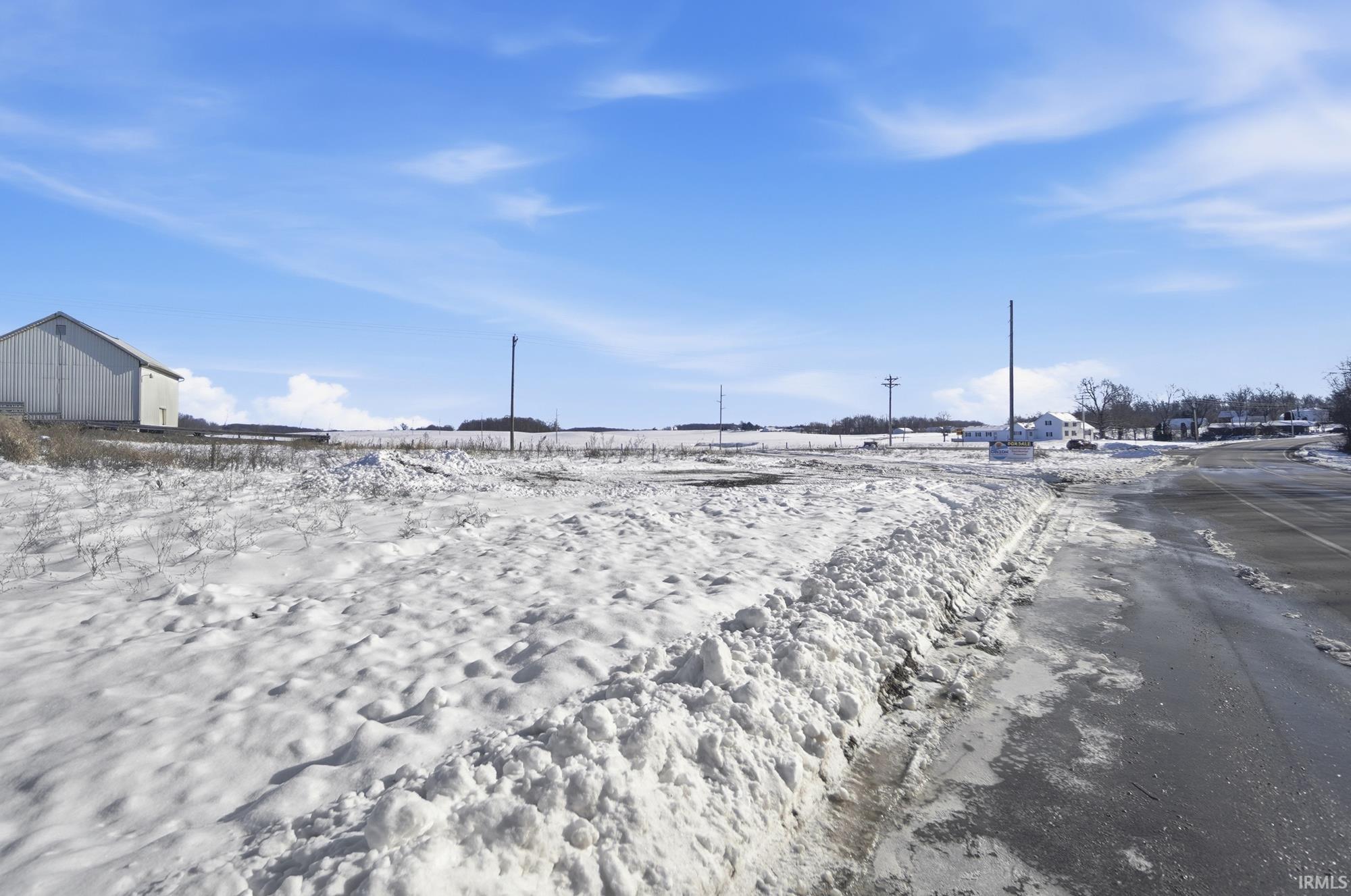 View of yard layered in snow