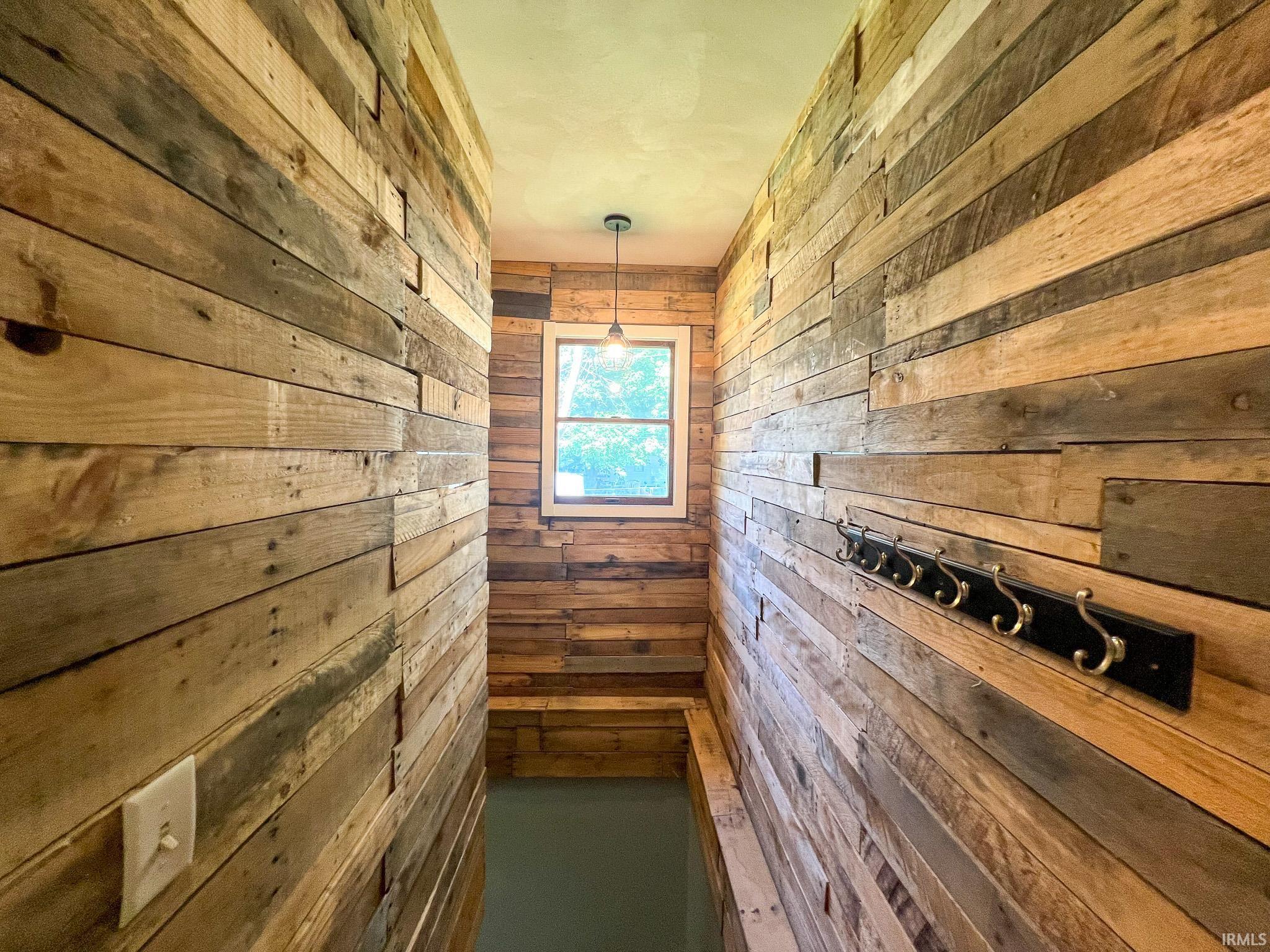 Wood accent wall leading to the finished basement