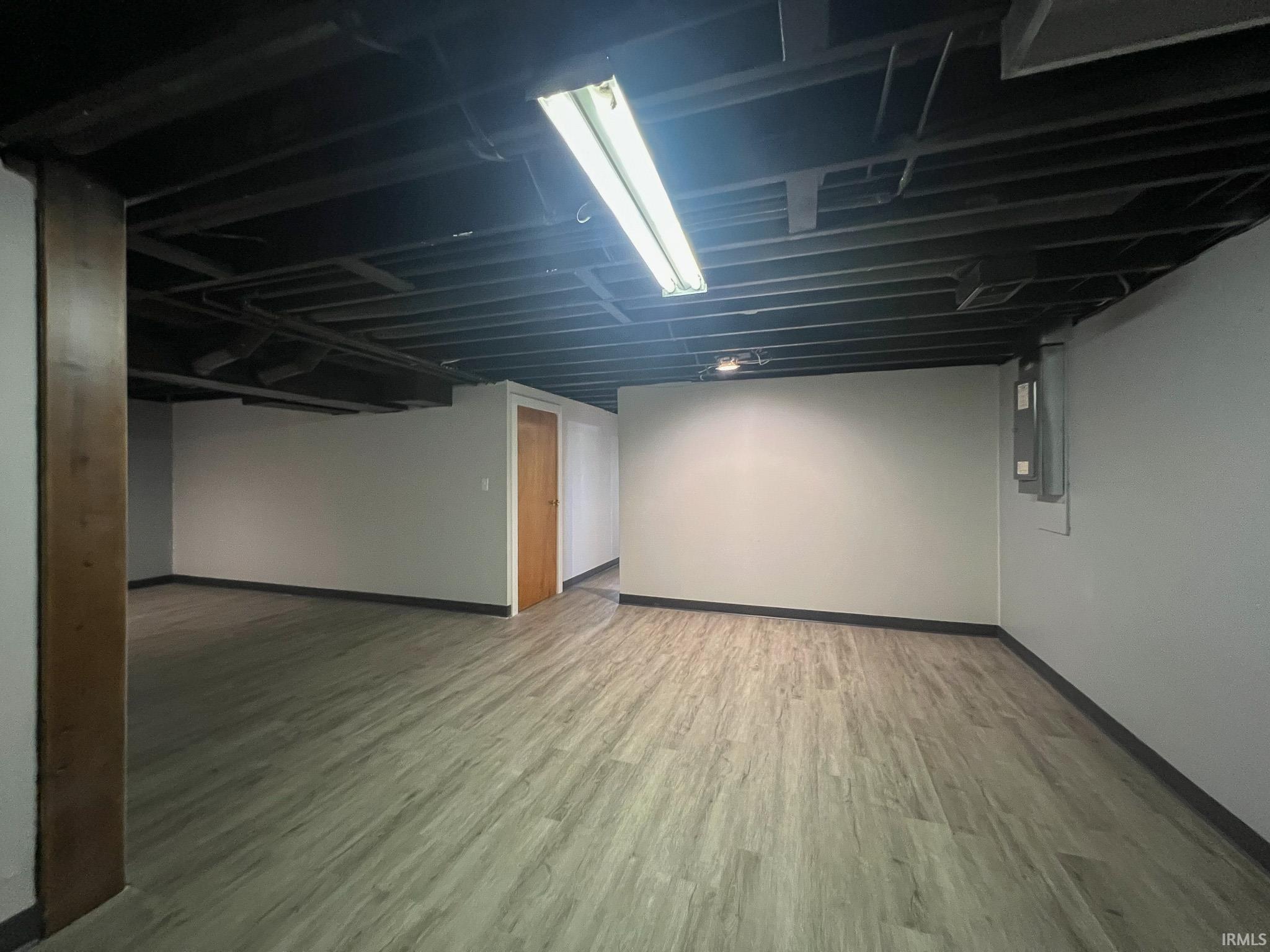 Finished basement featuring light wood-type flooring