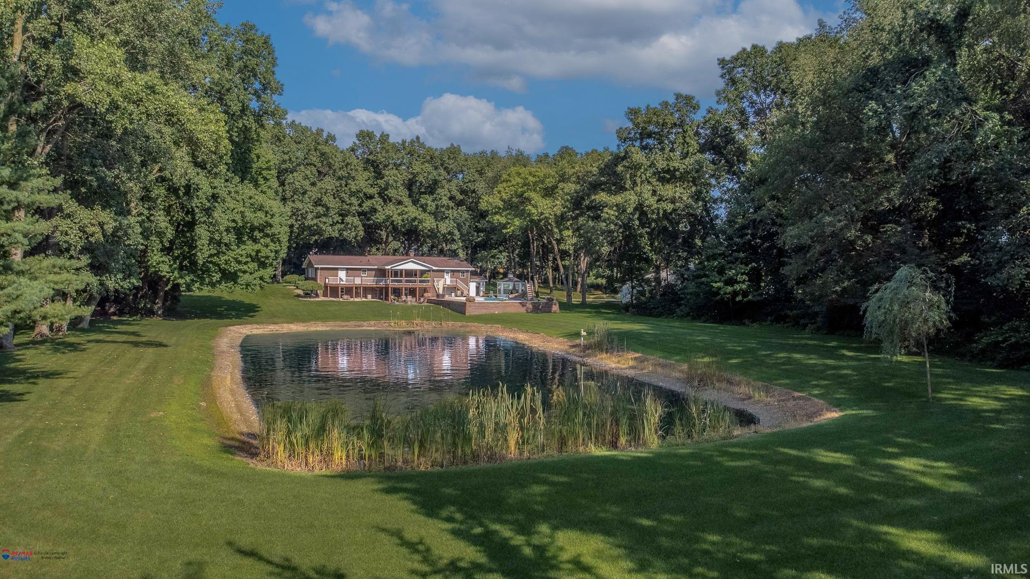 Rear of Property facing east, with a great view of the 1/2 + Plus pond.