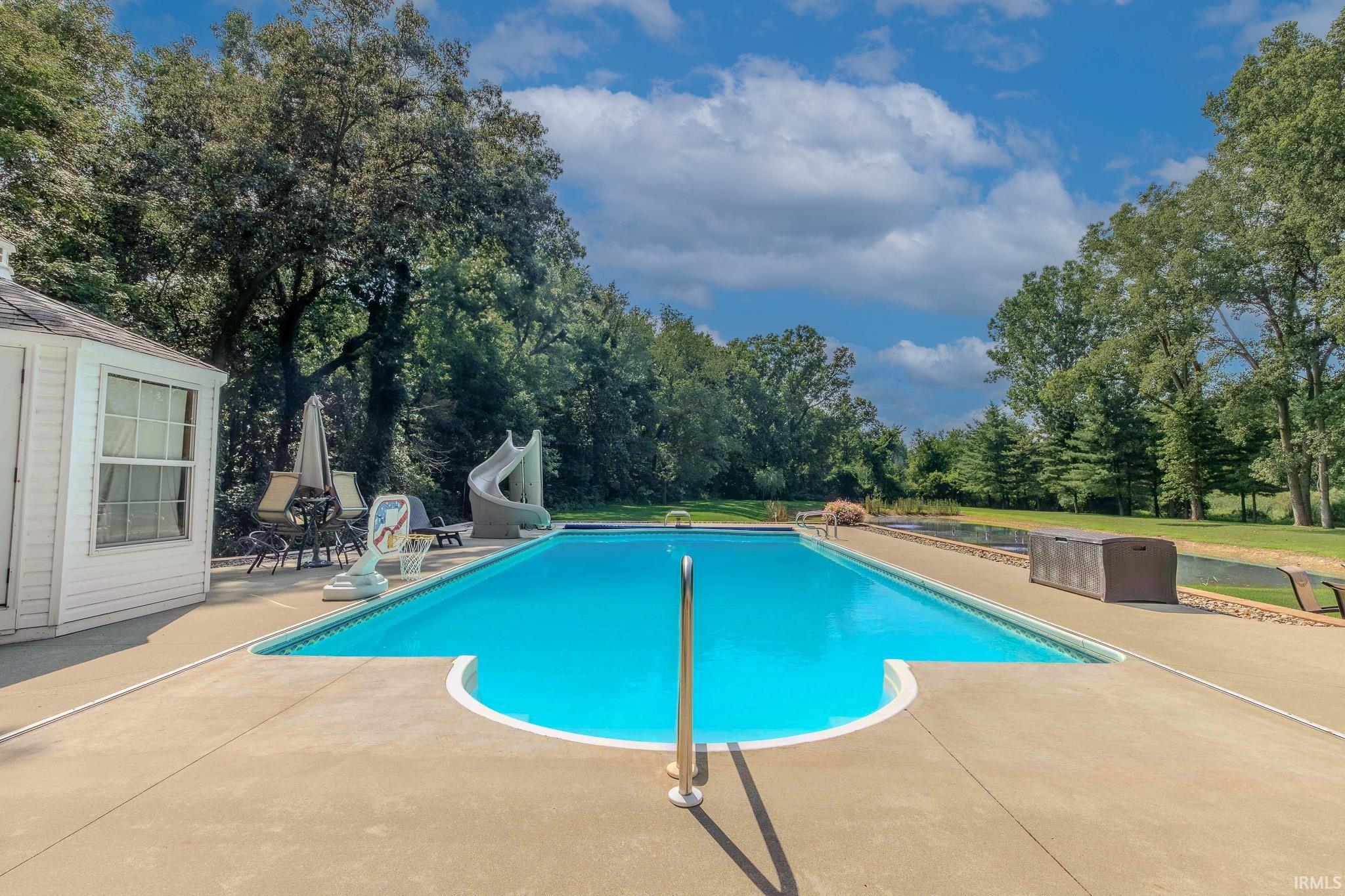 Saltwater Pool W/Autocover, powered water slide, diving board, Gazebo, ranging from 4' -10' Depth.