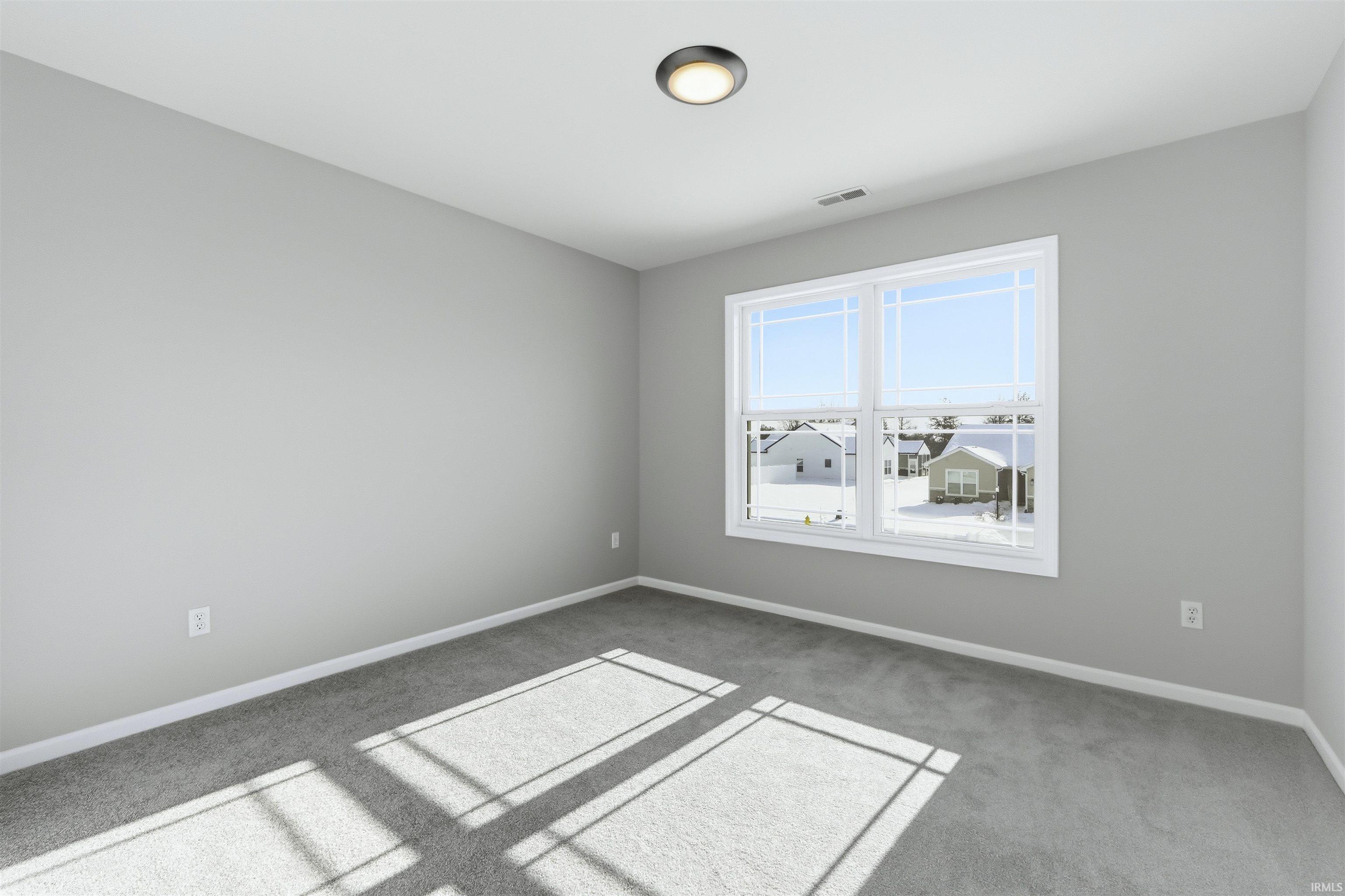 Empty room with light carpet