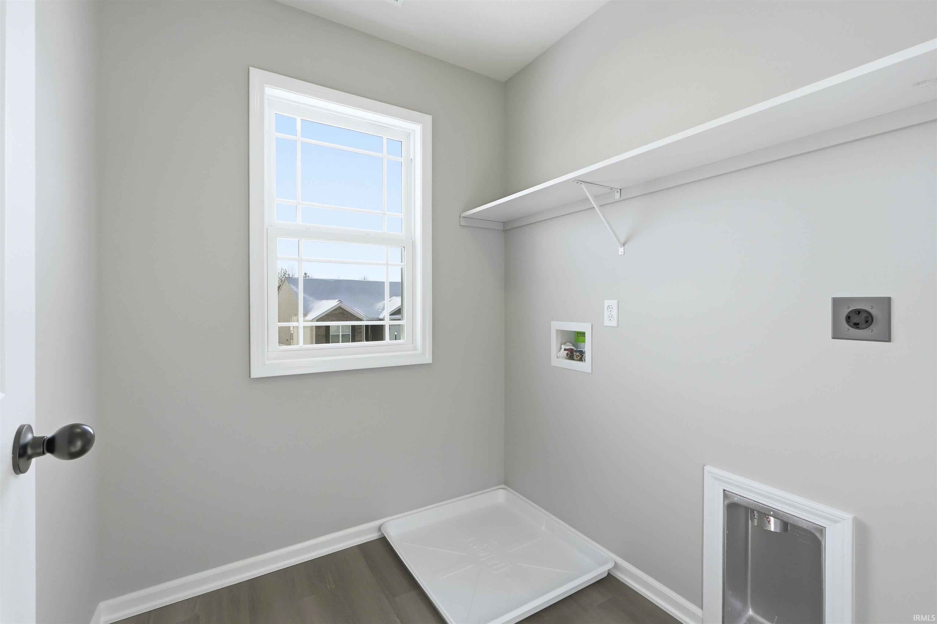 Laundry room with washer hookup, dark wood-style floors, and hookup for an electric dryer