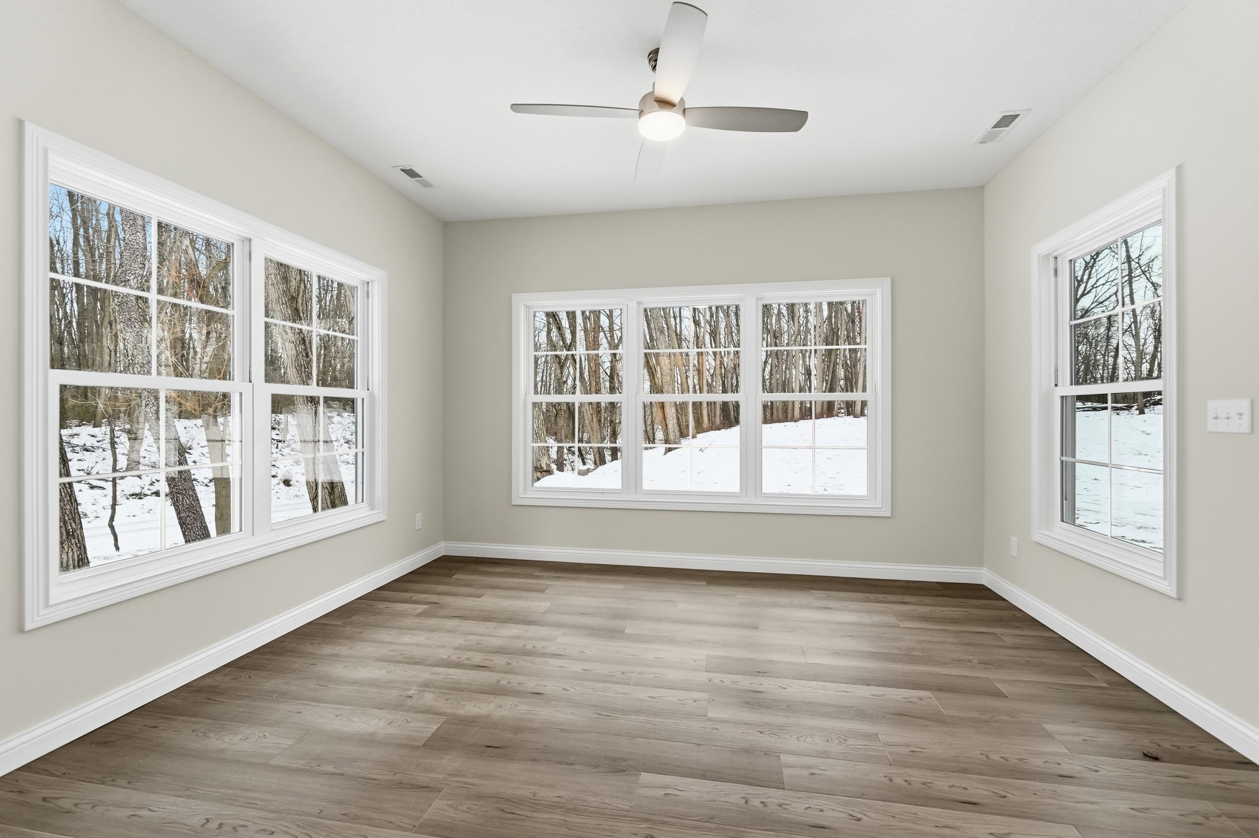 Unfurnished sunroom featuring healthy amount of natural light