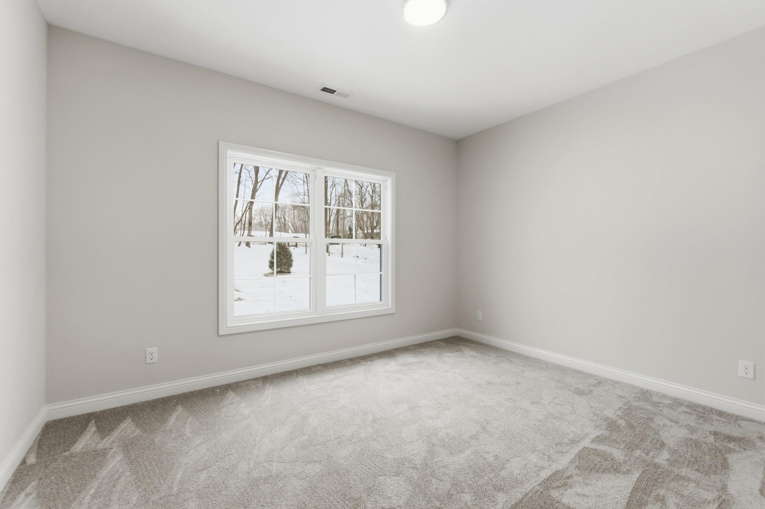 Empty room with baseboards and carpet floors