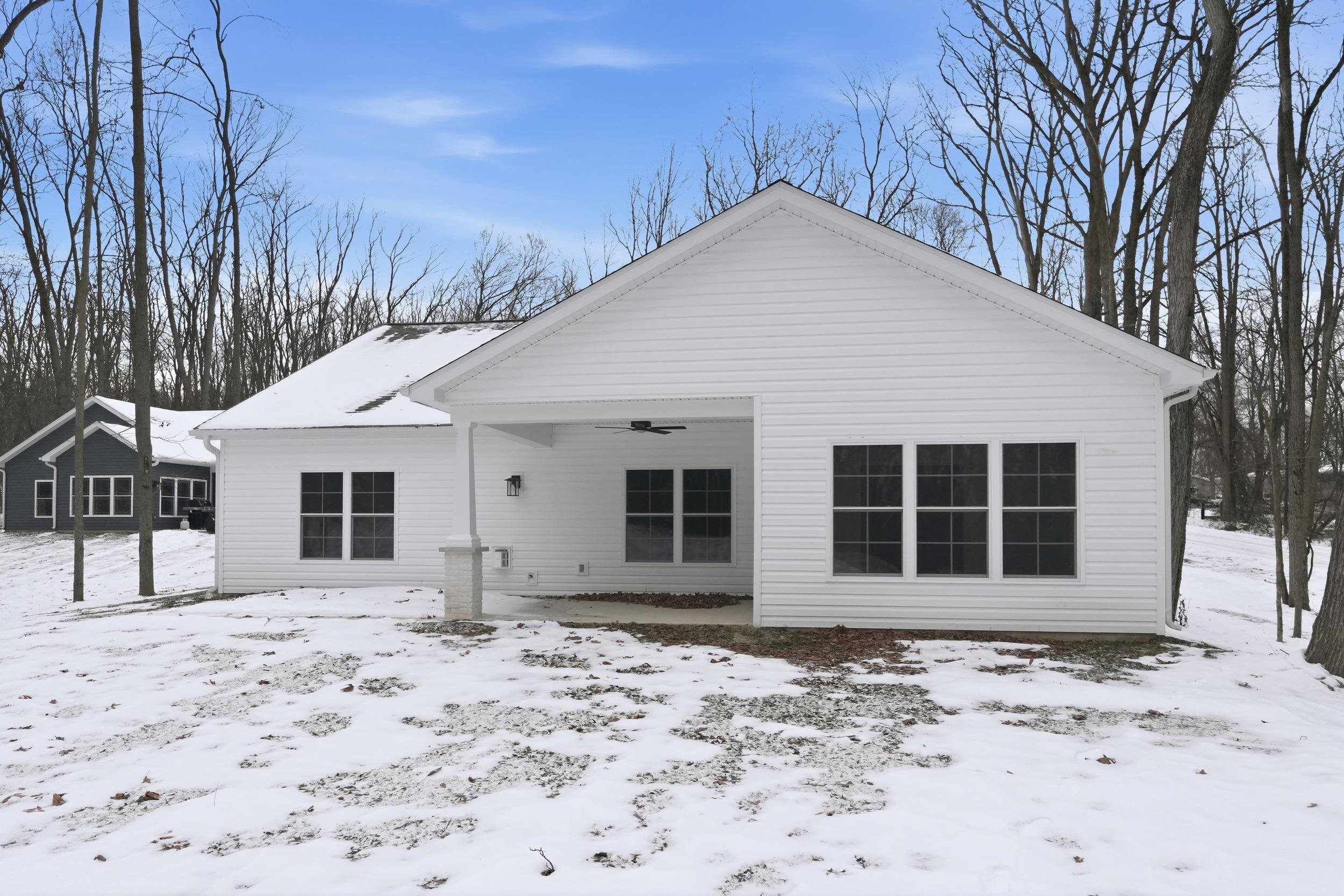 back of property featuring a patio and ceiling fan