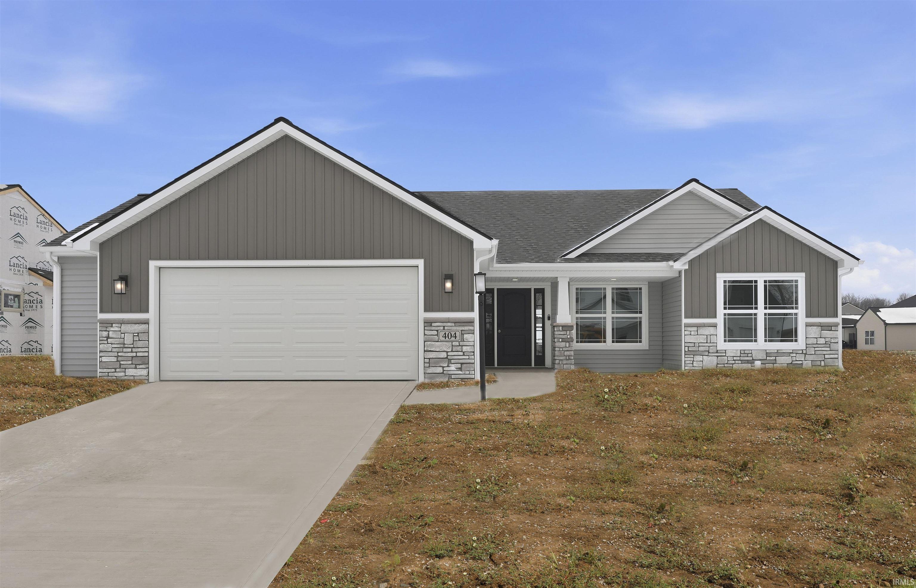 View of front of home with stone siding, an attached garage, concrete driveway, and a shingled roof