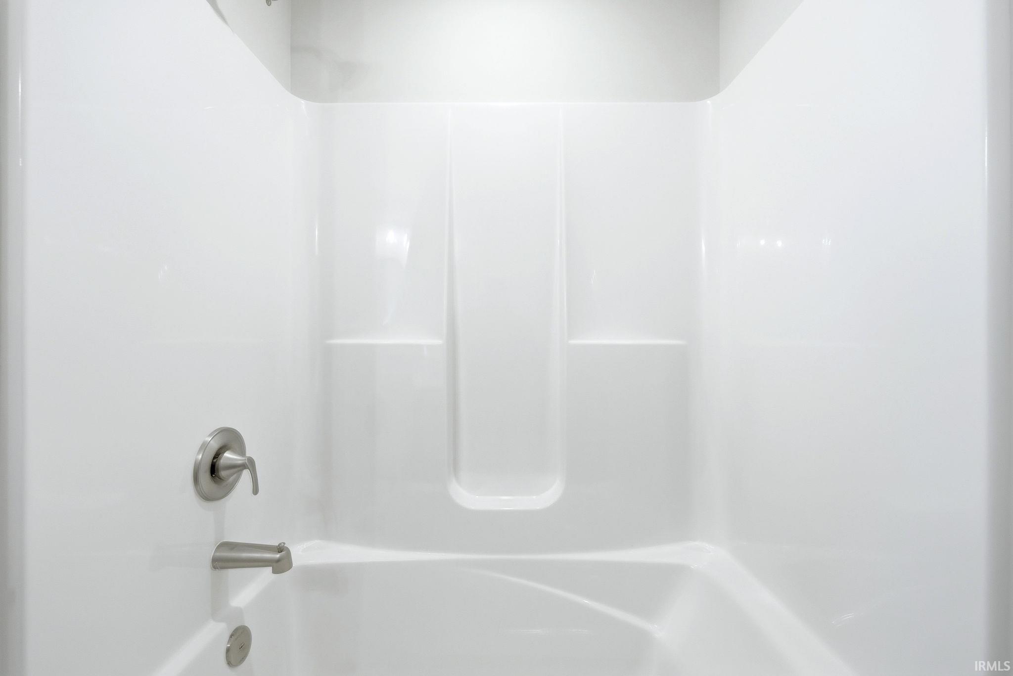 Bathroom with shower / washtub combination