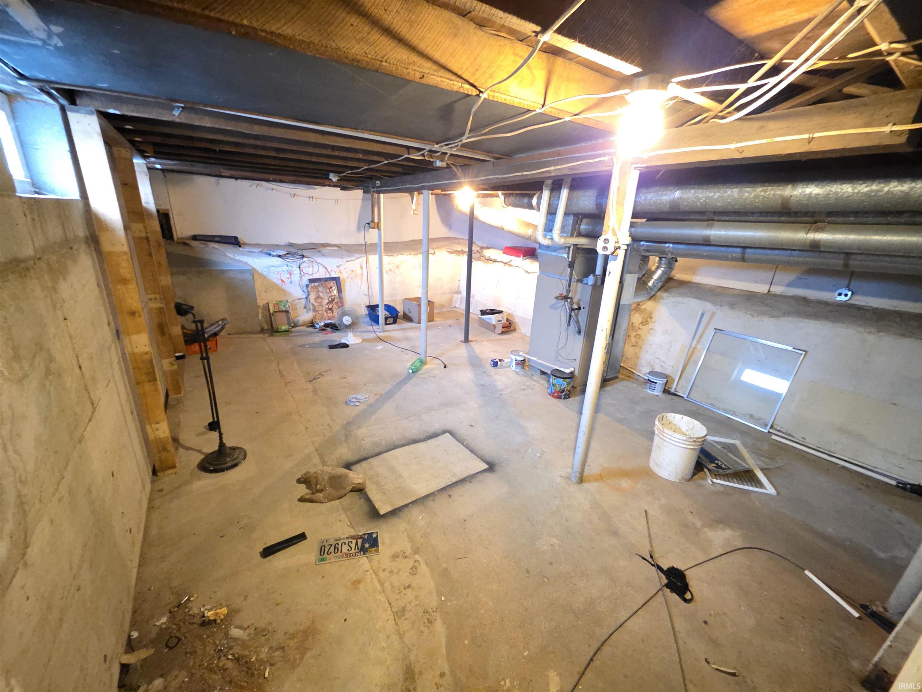 Basement featuring heating unit
