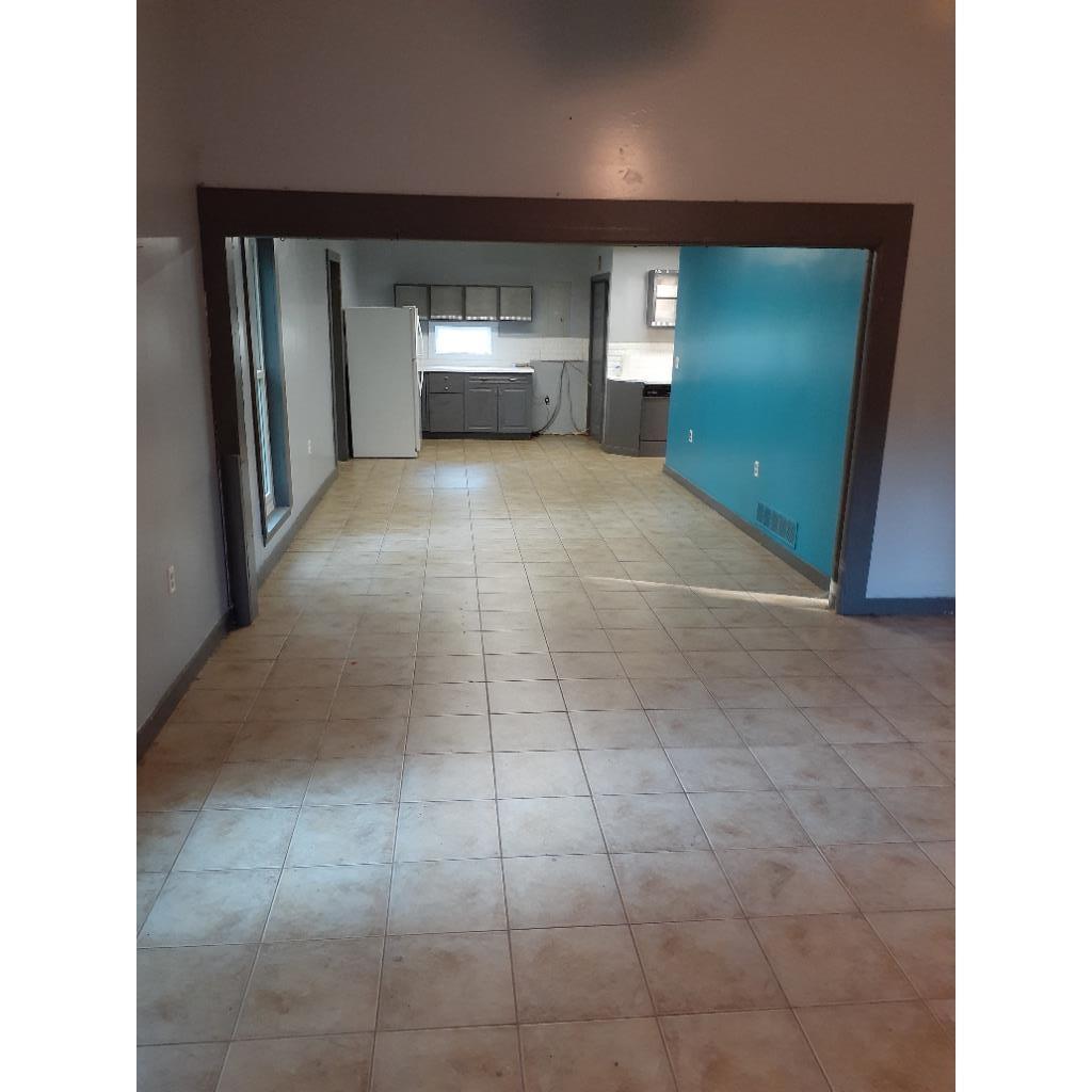 Spare room featuring baseboards