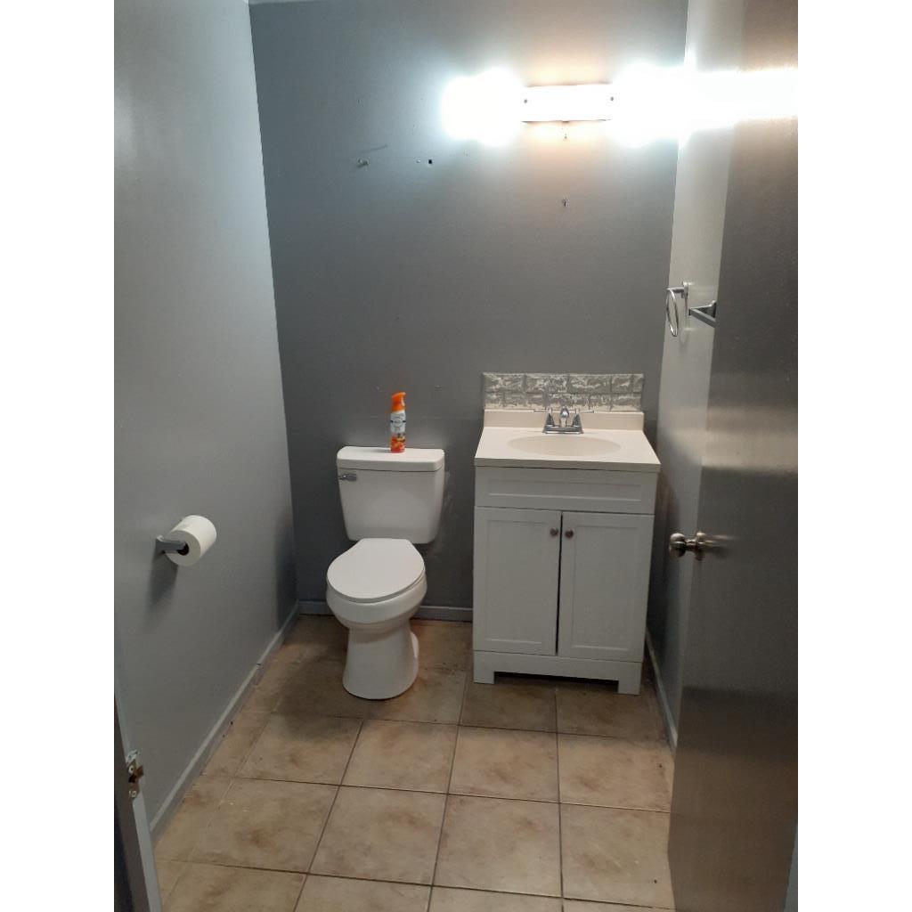 Bathroom with vanity and light tile patterned floors
