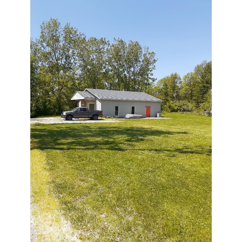 Single story home with a front lawn
