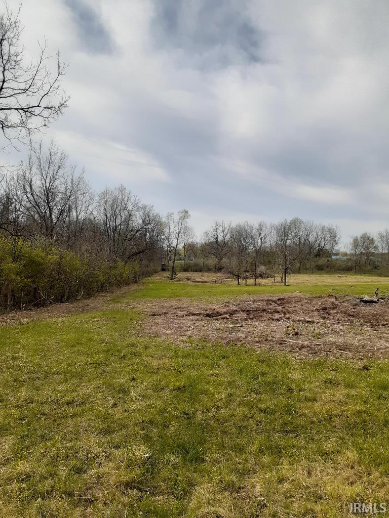 View of grassy yard with a rural view