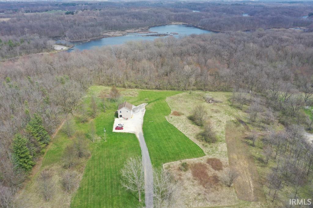 Bird's eye view of a heavily wooded area and a large body of water