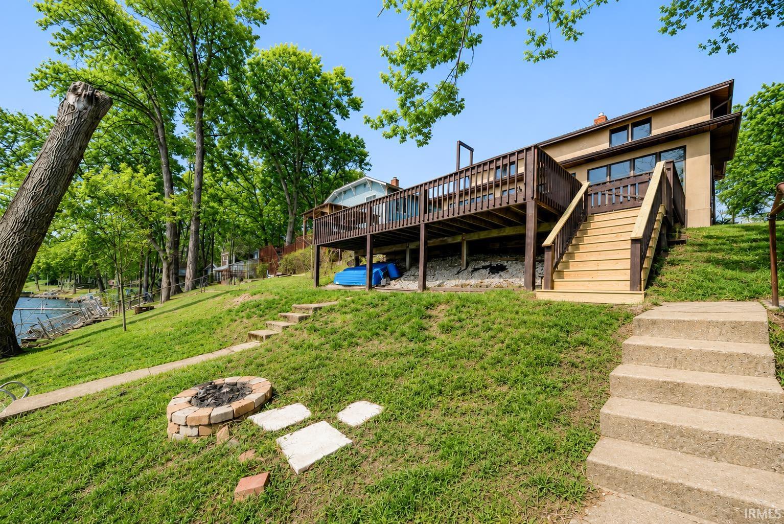 Multi-level rear deck with wood railing and stairs