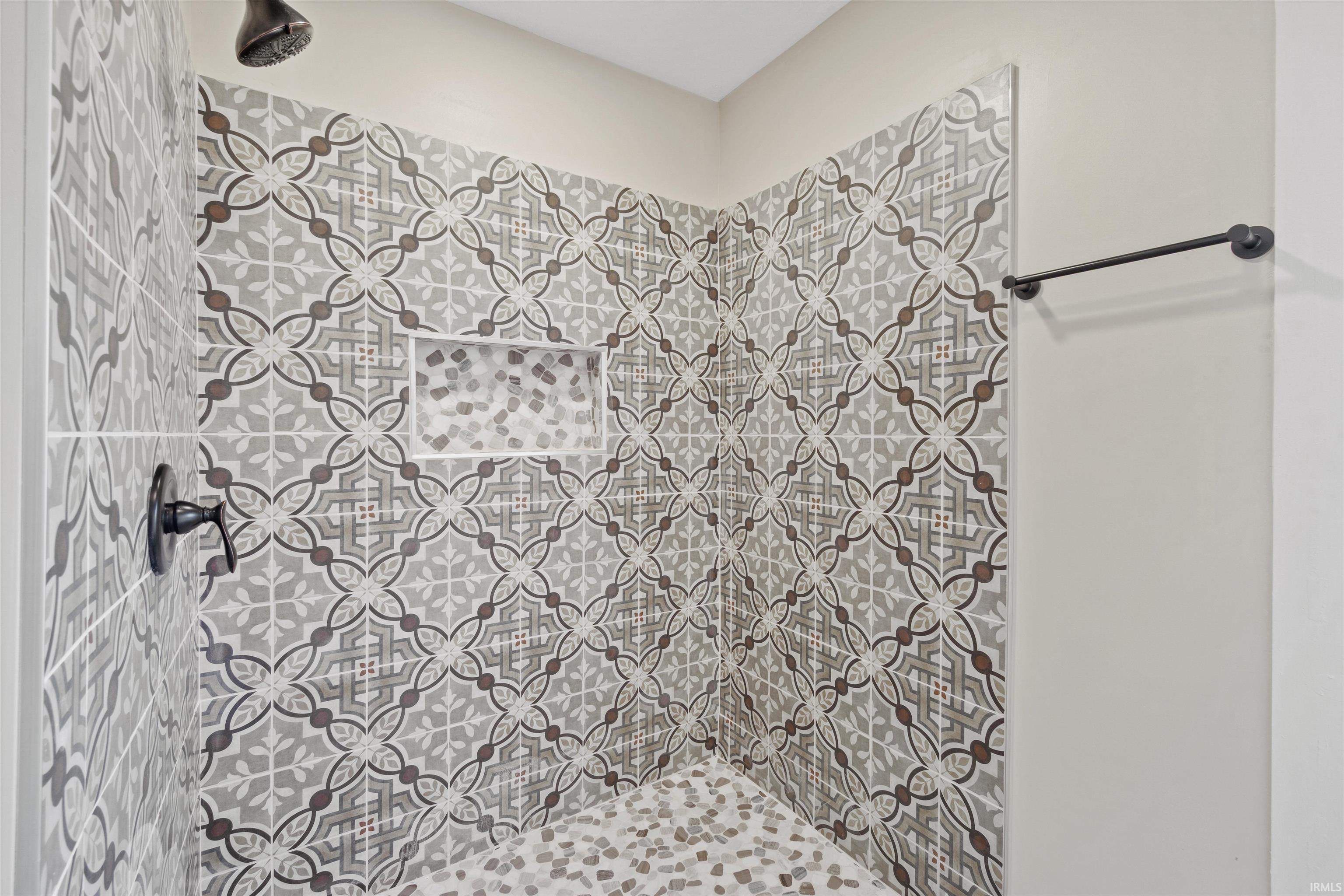 Full bath with a tile shower