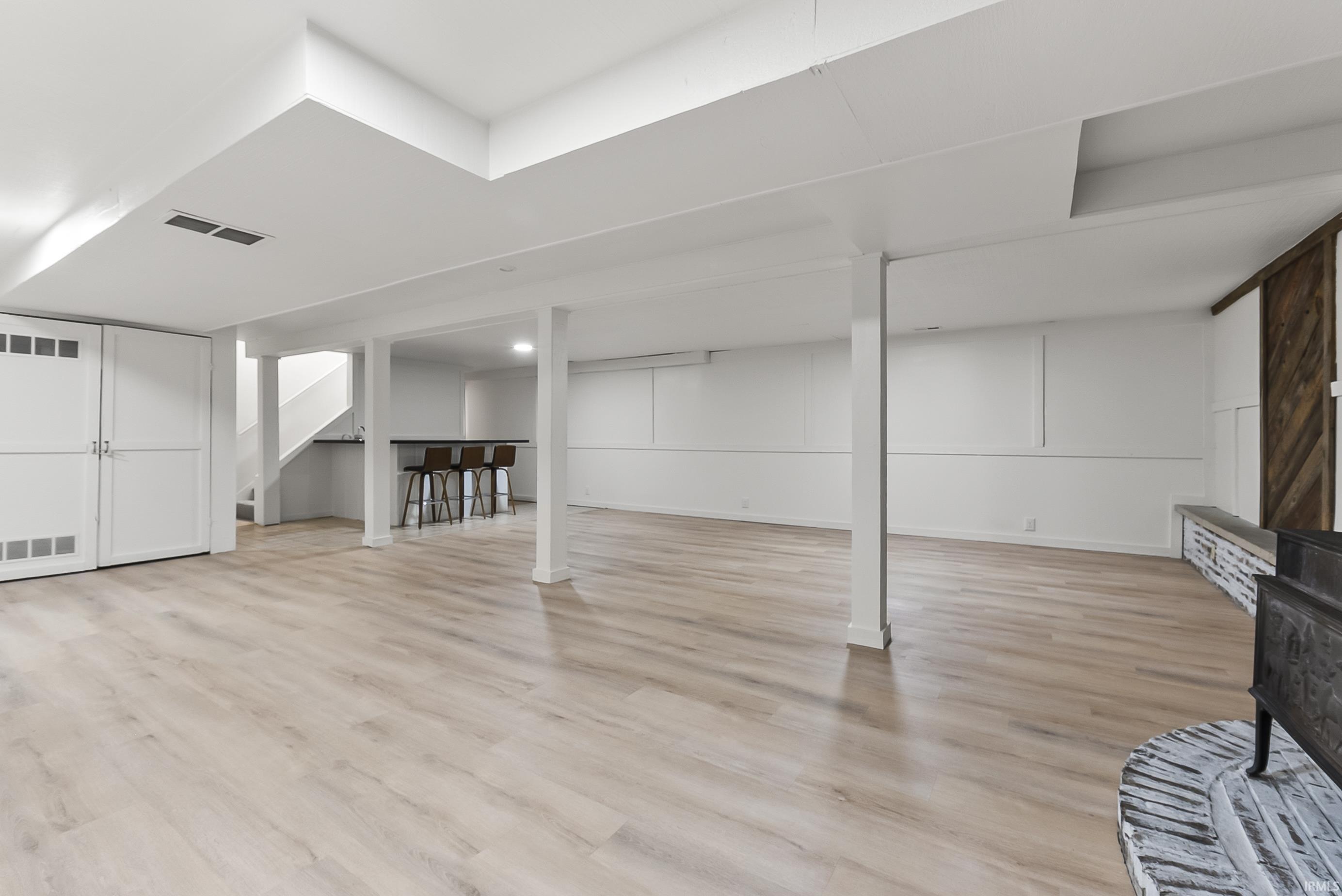 Finished below grade area featuring light wood finished floors