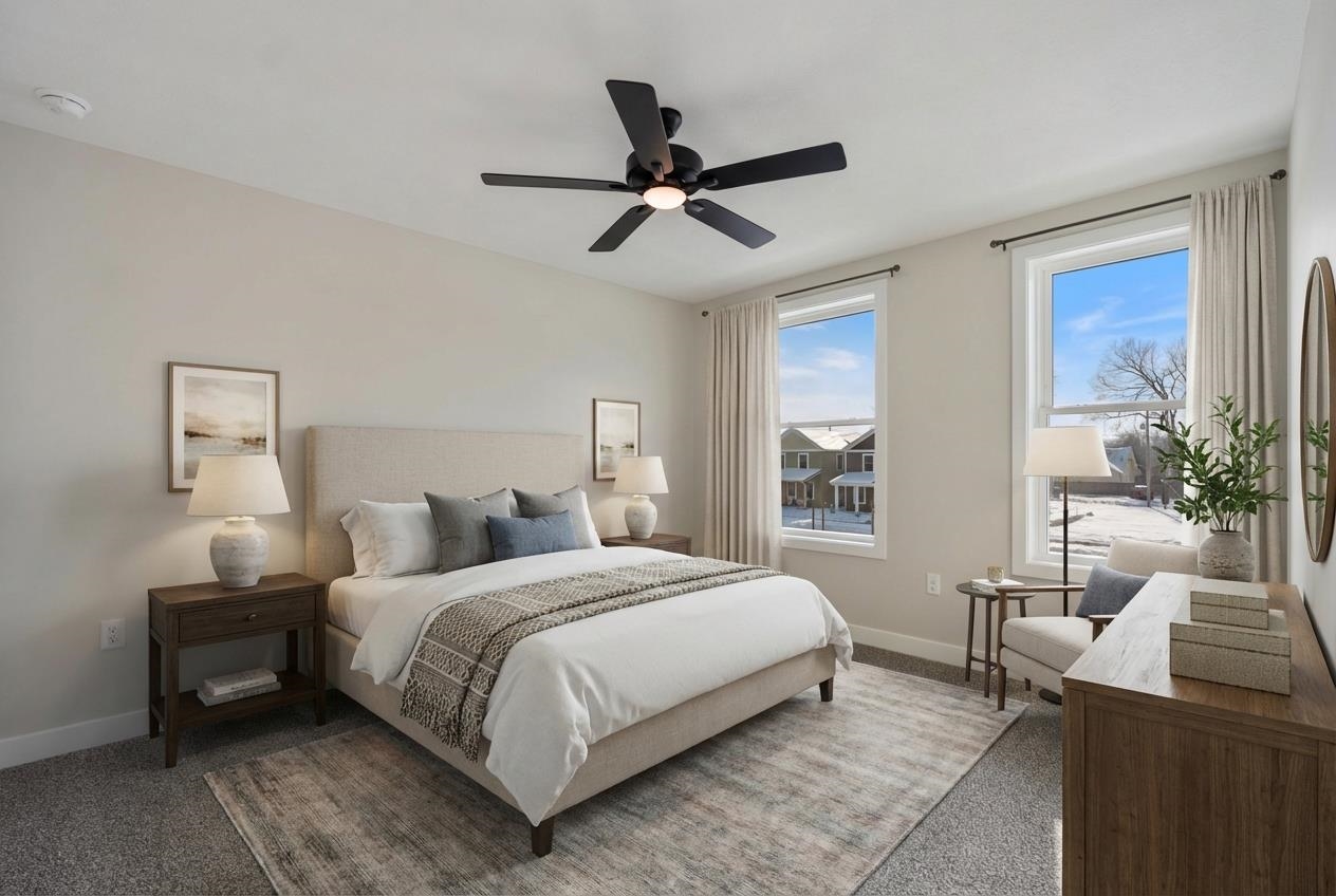 Bedroom featuring ceiling fan and carpet flooring