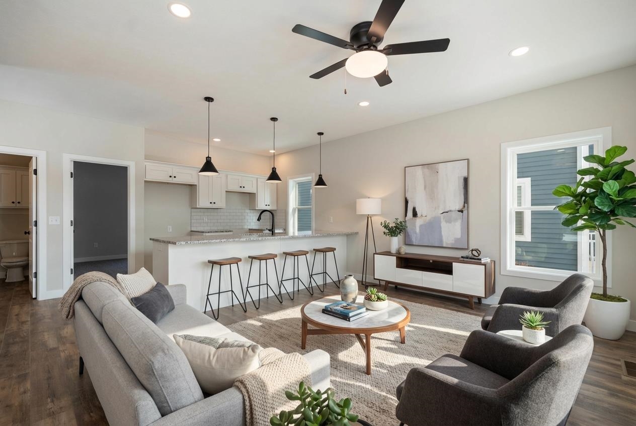 Living area featuring wood finished floors, recessed lighting, and ceiling fan