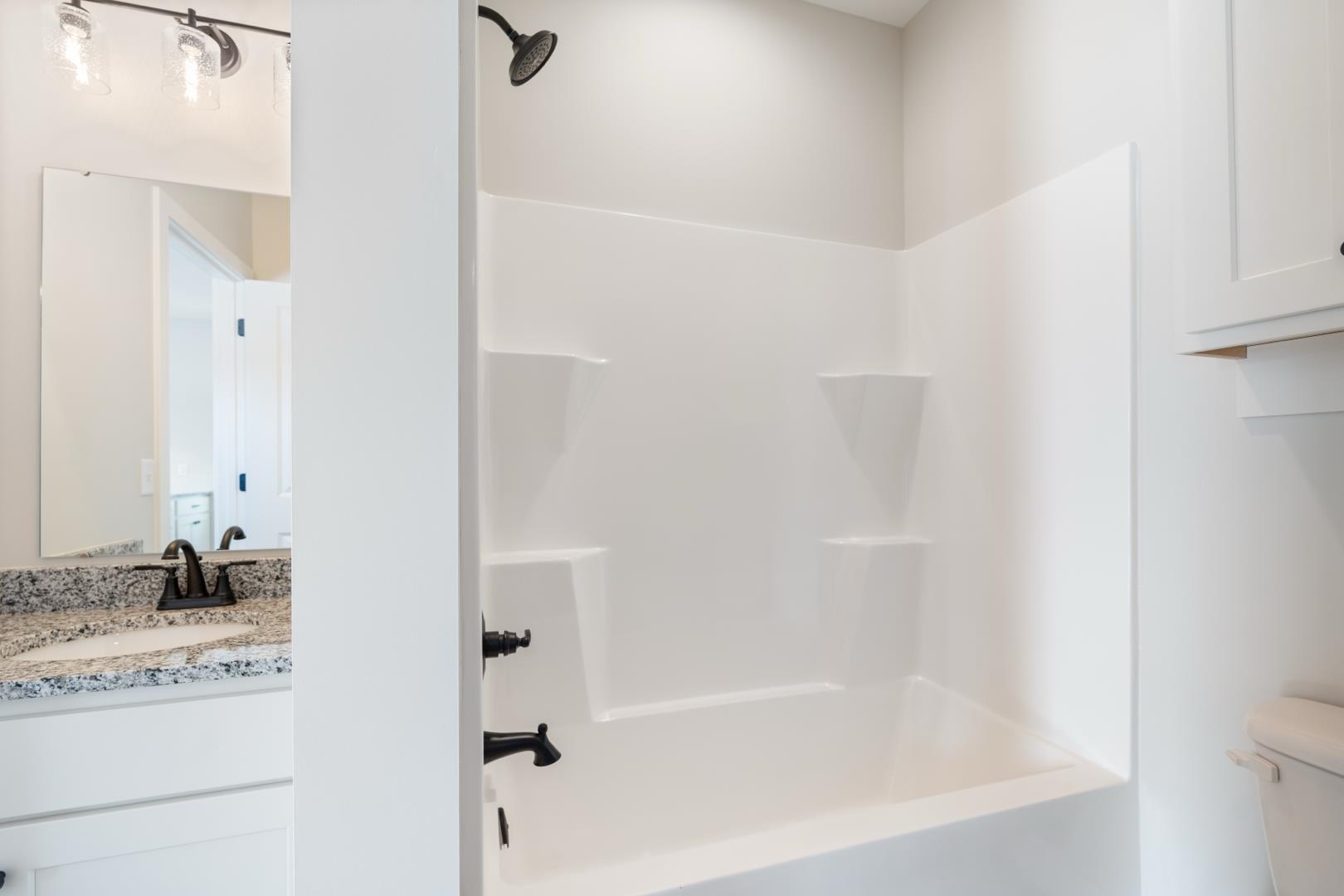 Full bath with bathing tub / shower combination and vanity