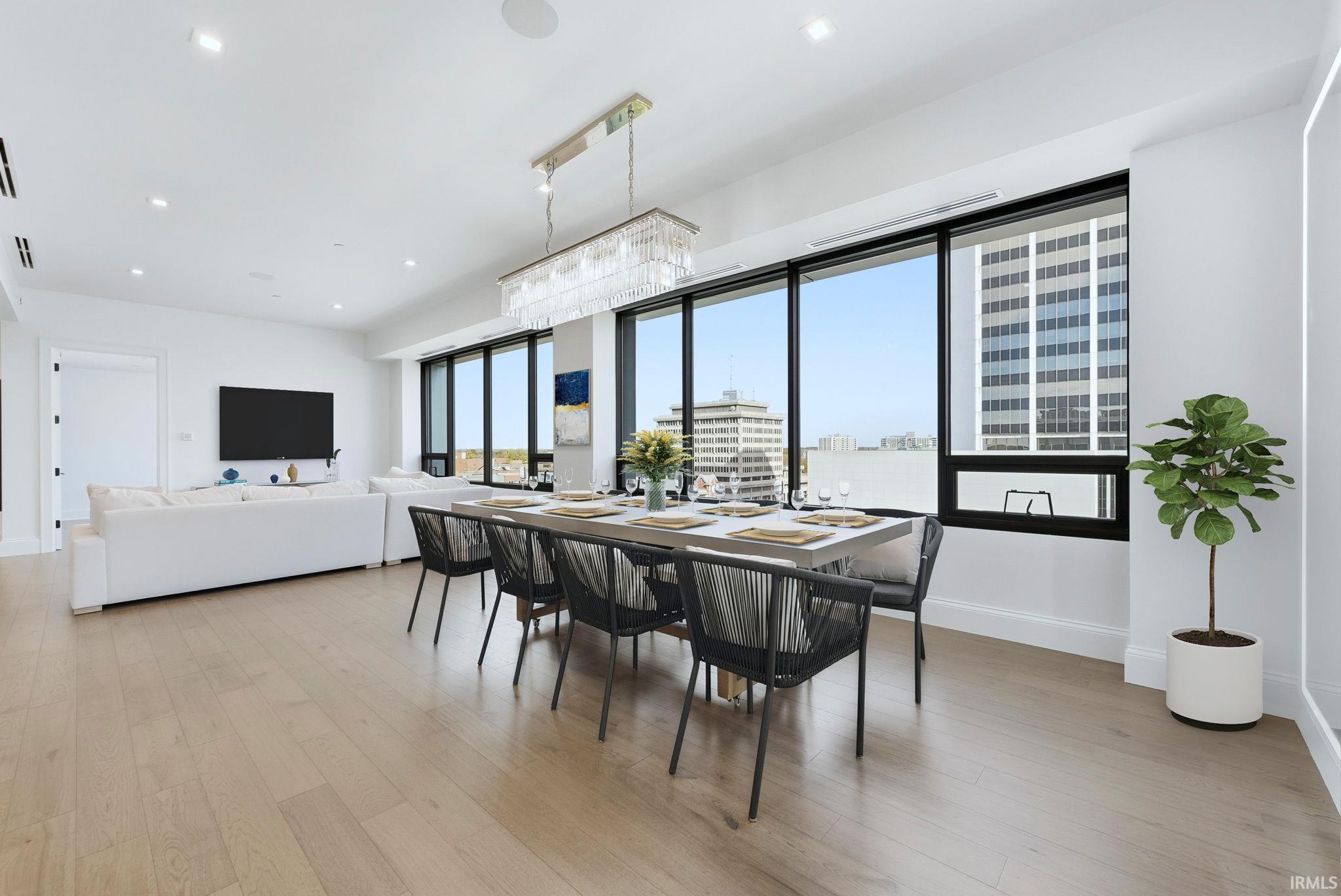Dining space featuring light wood-type flooring and recessed lighting