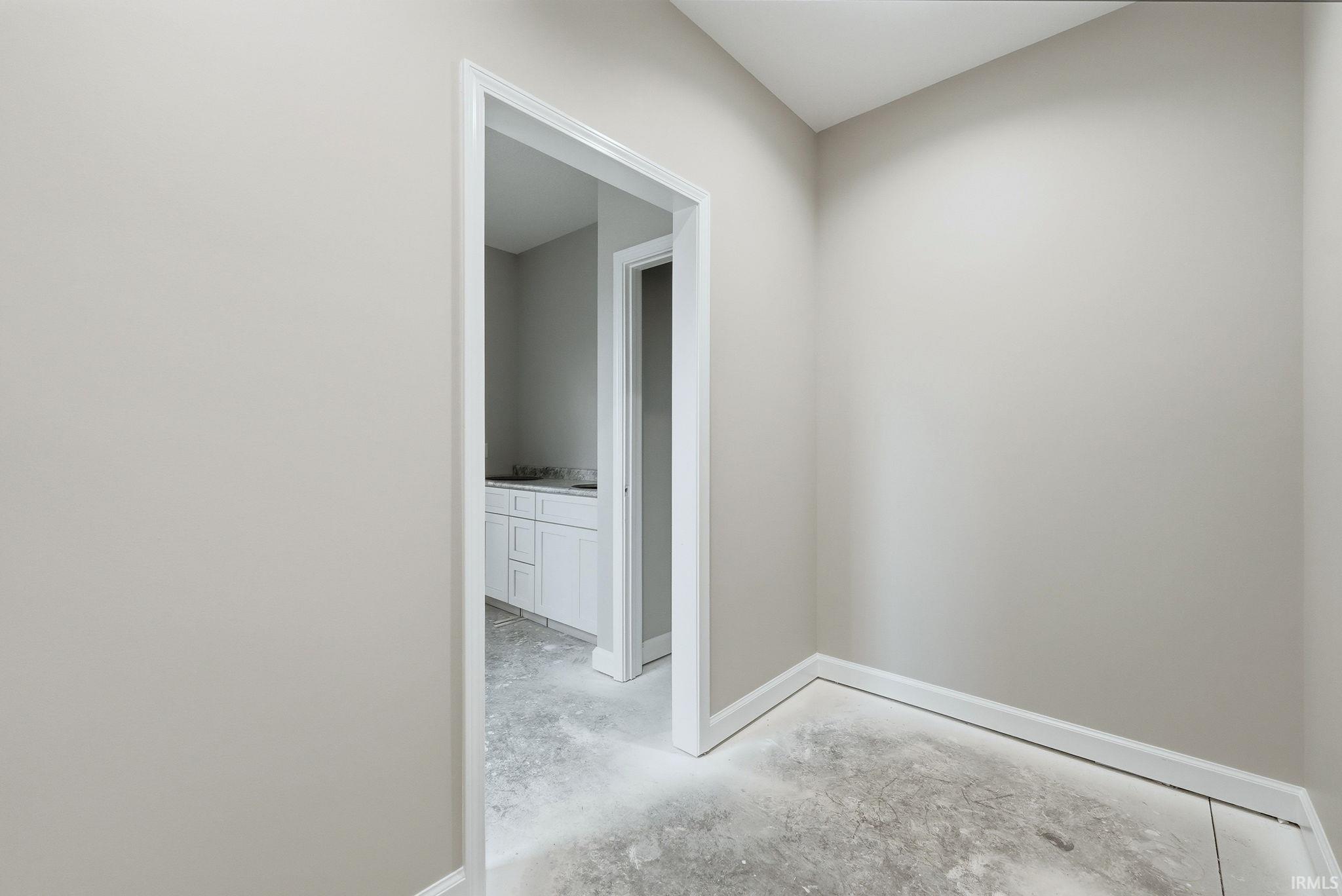 Corridor featuring baseboards