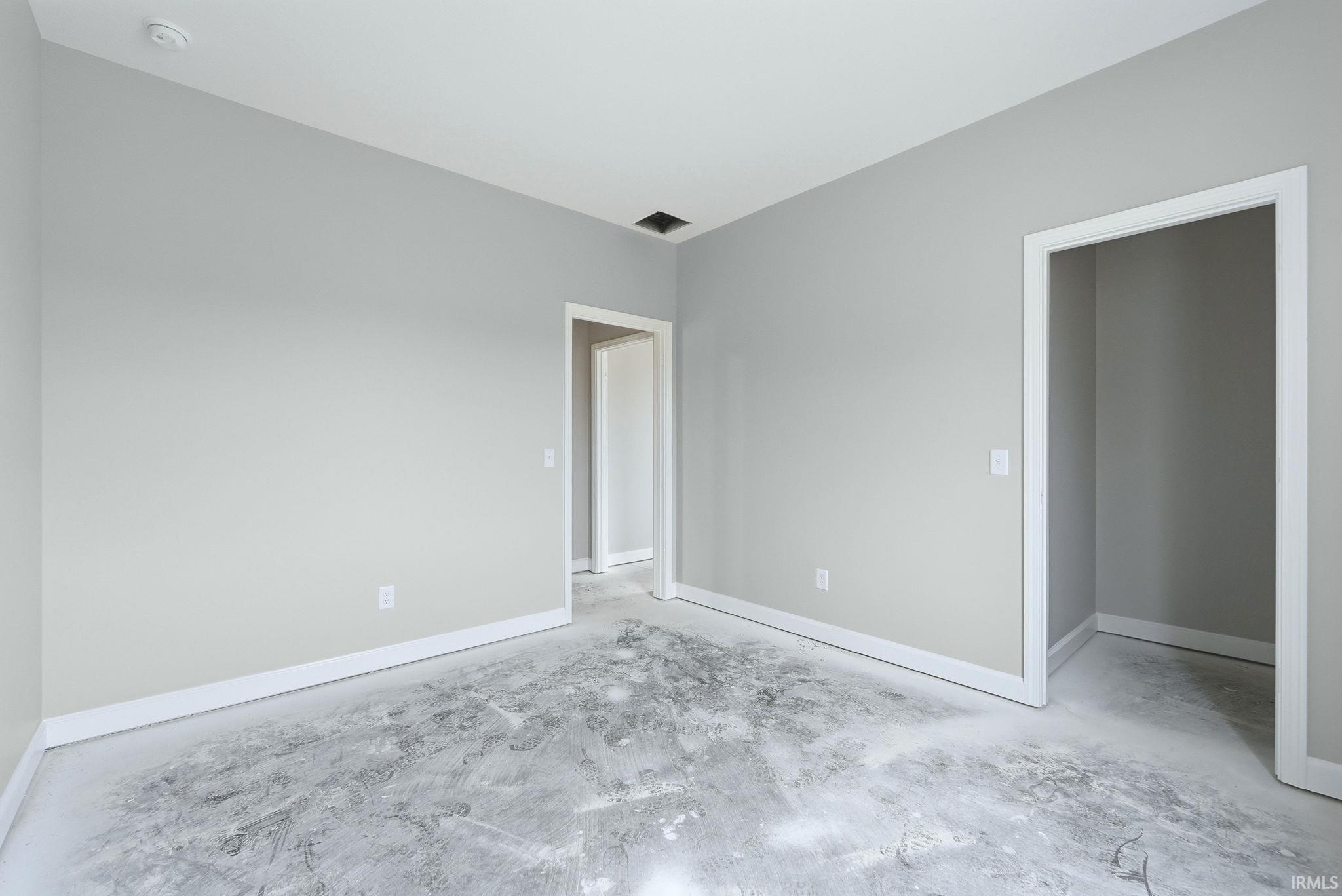 Unfurnished bedroom with baseboards