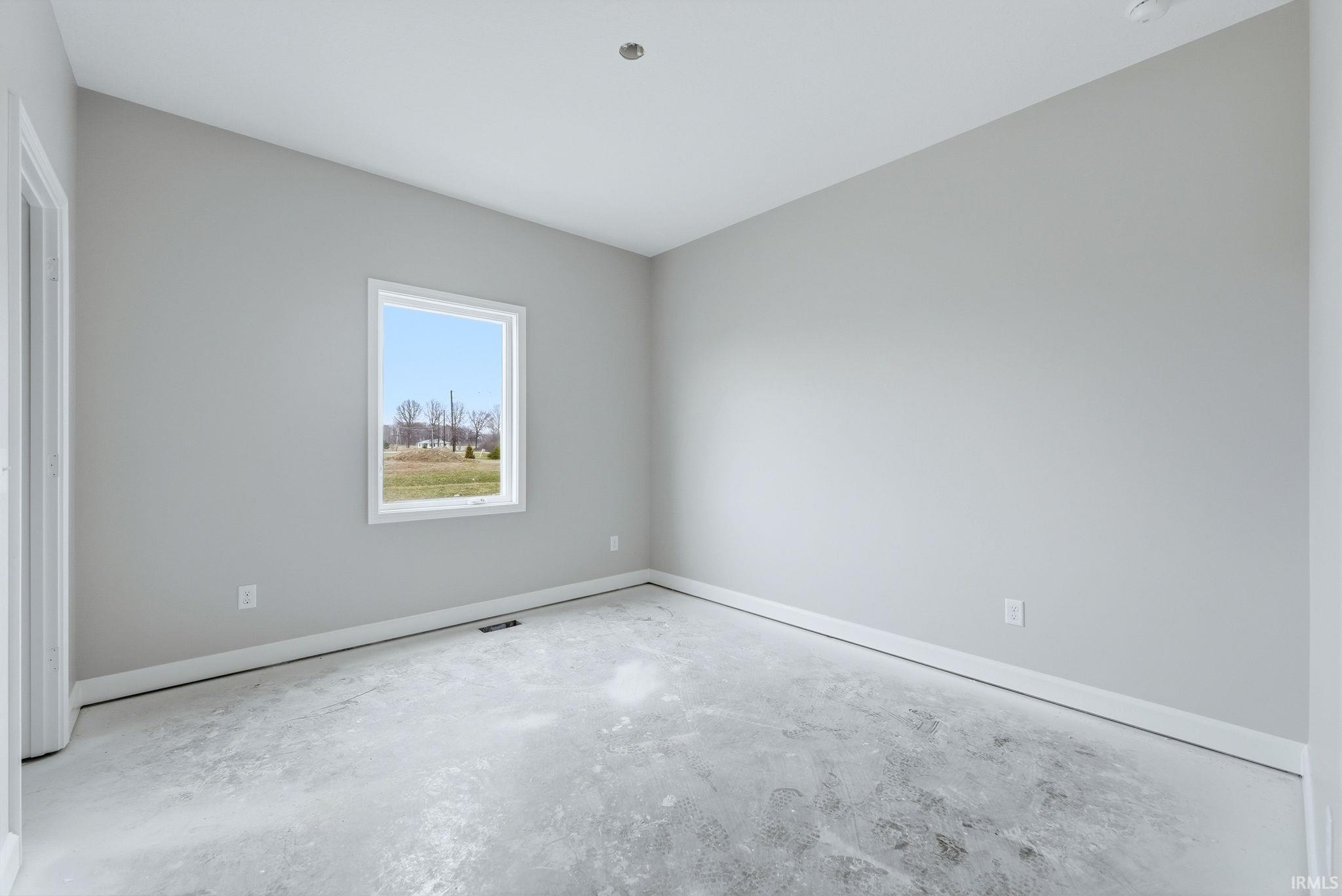Unfurnished room featuring baseboards