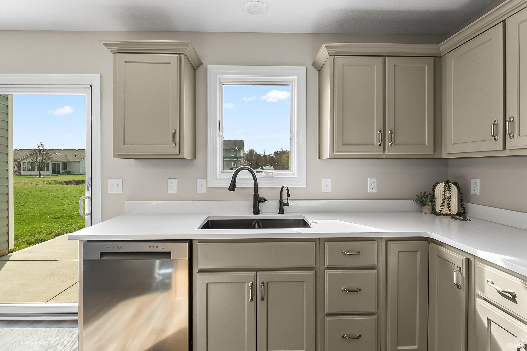 Kitchen with dishwasher and a sink